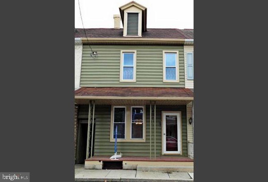 Completely redone inside and out. A must see. New windows, siding, half bath and laundry on 1st floor, new carpet, laminate and painted. Balcony on 2nd floor, deck off back porch, 1 car garage with attached storage.