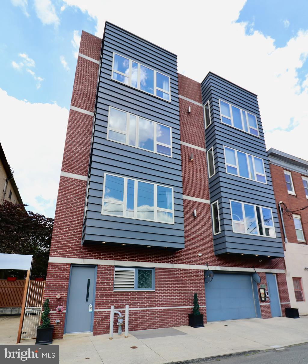Welcome to this stylish and spacious 2-bedroom, 2-bath condo with secure garage parking nestled in one of Philadelphia’s most vibrant neighborhoods! Featuring an open-concept living area with 10’ ceilings, hardwood floors throughout, and large windows that flood this space with natural light, this home blends comfort with contemporary design. The sleek kitchen boasts quartz countertops, stainless steel appliances, and ample cabinet space - perfect for cooking and entertaining. The primary bedroom offers a private ensuite bath and custom California Closet, while the second bedroom features sliding glass doors to a private patio. Enjoy the convenience of in-unit laundry, Nest smart thermostat, and keyless entry. This boutique 12-unit building is pet-friendly and offers climate controlled garage parking, extra storage unit, an elevator, and video keypad touchscreen entry for added security and peace of mind. Just steps from Whole Foods, Acme, the Italian Market, restaurants, parks, and public transit, experienced all that Bella Vista has to offer! This condo offers the best of urban living. Schedule your tour today for this must see fabulous condo!
