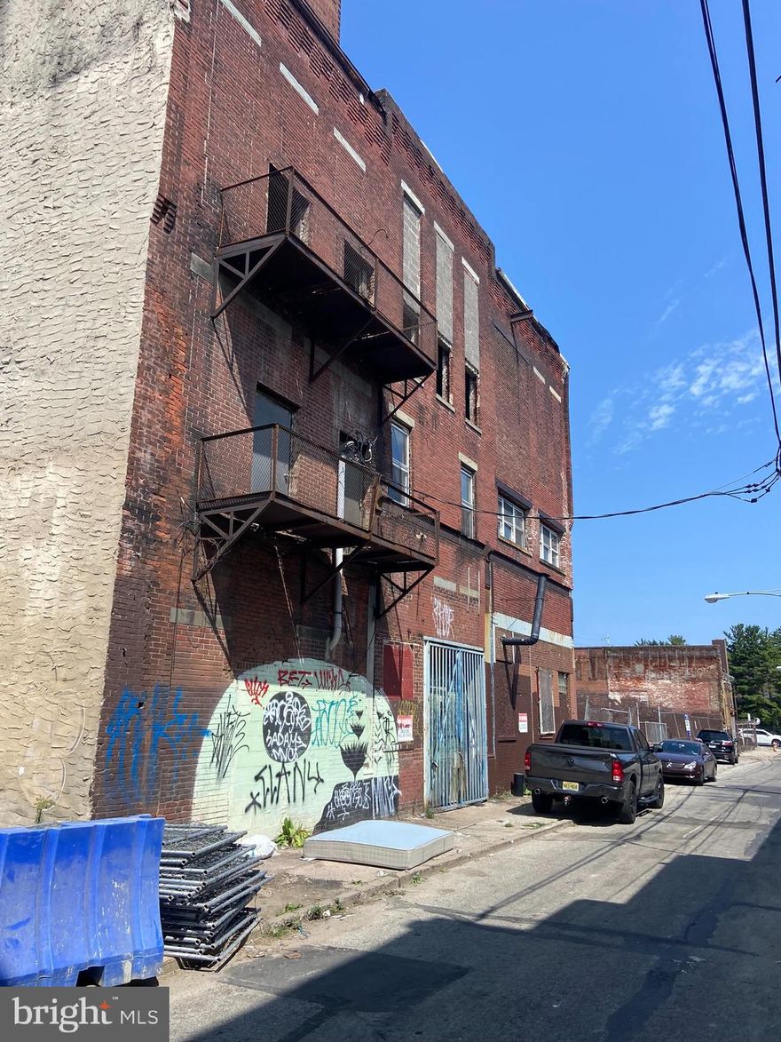 17,740 +-  sq ft stand alone building- warehouse for sale close to 9th and Girard ave. in an OPPORTUNITY Zone. This project is approved for 20 residential units and one ground floor commercial with off-street parking ( schematics provided).
Commercial/Multi-Use construction is blowing up all around this location, with  High density construction in the area , and  in great proximity to center city without the high-end cost of center city prices. The building has 17 ft ceilings with 2 large 16ft roll-up doors (front & back ) and 2 smaller roll-up doors  both opening onto 9th st. The building was purpotedly   used as a Tastykake manufacturing facility at one time (not documented) , Elevator access to all three floors (shaft  only still in place)  . Rear unit  ground floor @ 3200  sq ft,  same for front. Second & third floor all open space,  available  Spaces on second & third floors  ha ve massive ceilings and support columns,  and 3rd floor has an atrium roof. . One half bath on ground floor. bathroom and office have been remodeled. The building is in good condition with gas radiant overhead heat. The electric includes 3 phase, and single-phase electric services. The build is in a PRIME redevelopment/ opportunity zone and being sold with approvals and achitechtural renderings ready to go for  the abitious developer.  Approvals with L&I  does have a possible 4th floor addition. 
 located on the elevated Septa line from C C to Trenton NJ. Next door vacant lot may also be available (other broker listing).