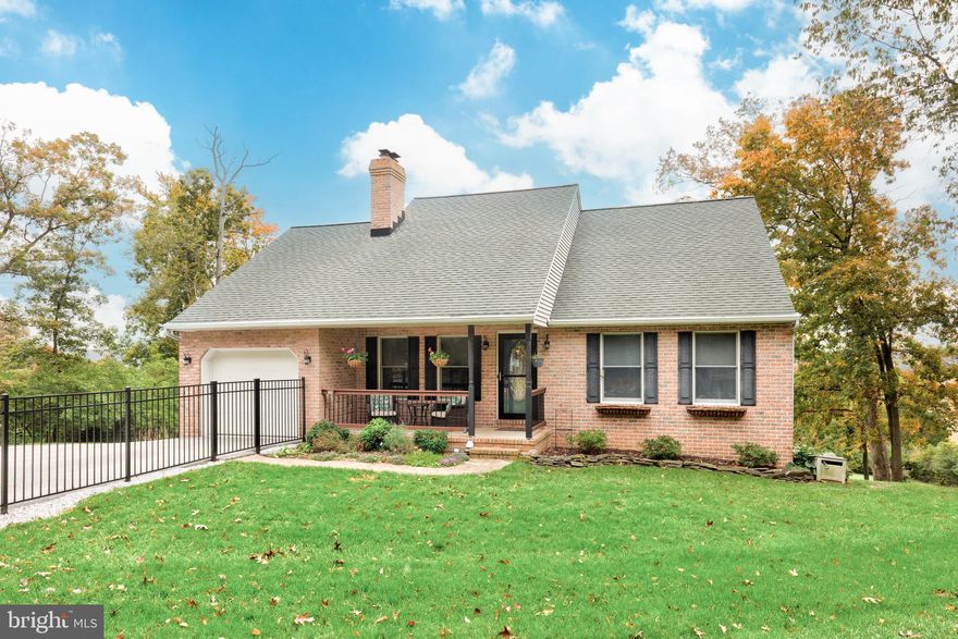 Price improvement on 1120 Bradley Drive.  Privacy and proximity to everyday conveniences rarely come together, but here you will have both. This charming 3-bedroom, 3-full-bath Cape Cod offers exceptional living space inside and out, along with beautiful countryside views.  The living room welcomes you with beautiful hardwood floors, a vaulted ceiling, and a cozy fireplace w/ mantel. The spacious, centrally located kitchen provides the perfect hub for meal prep and gatherings, updated with new countertops and appliances. Just off the kitchen, the laundry/mudroom offers an oversized pantry—ideal for bulk storage—and both mud and kitchen have direct access to the back deck.  If you are an early riser, you can catch an amazing sunrise with your coffee from the deck.  The main level also features the owner’s suite along with an additional bedroom and full bath. Upstairs, you’ll find a third bedroom and bathroom, plus two unfinished spaces ready for storage or future expansion.  The finished lower level adds more versatility, with a rec room or office option, pellet stove, and a level walk-out to the backyard. Outside, you’ll enjoy a fully fenced yard that’s partly wooded with a shed and has room for gardens.  This is perfect for outdoor living, play and relaxation.  This home combines peaceful living on a private road with the convenience of shopping and amenities just 10 minutes away.   To top it off, caring owners have meticulous maintenance records to pass on to the next owner.