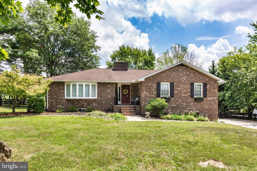An attractive all-brick rancher with updated windows on the main level, featuring three bedrooms, two full baths and a half bath. The lower level includes a fourth bedroom, a half bath, and a versatile entertaining space with LVT flooring, ideal for guests along with extra storage. The spacious main level boasts two living areas, a large kitchen, a brick woodburning fireplace, and two exits leading to the open-air deck.
The property also includes a two-story barn with an oversized office, an upper deck 16'X12' includes an awesome sunrise view, a balcony, and lower-level storage measuring 21'X16'. The expansive pole building(40'X20') is equipped with heat, 220V, ample natural light, garage bay doors 10'X8.5', insulated walls, and a front entrance overhang perfect for relaxing after a day's work. A Generac generator ensures uninterrupted comfort during power outages.
The broad backyard offers ample space for the gardens you've always dreamed of. The property is heated with multiple options including the heat pump with oil backup, a woodburning fireplace, and a propane stove for the lower level.  It's your decision on what system you prefer to use and enjoy. Located in the Hereford zone with the convenience of Falls Rd, and Route 30 corridor.