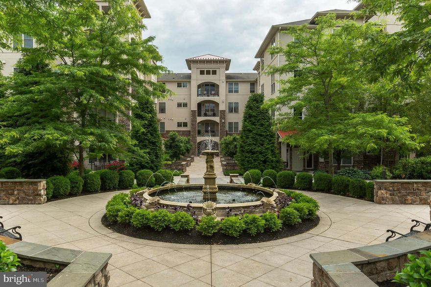 Welcome to this beautifully appointed Ethan Model, the former model home at Terrazza of Newtown Square, a turnkey maintenance free lifestyle community. Immaculate and like new throughout, the spacious corner terrace design features a sophisticated open floor plan with abundant light and 9 ft ceilings. The open living room with a gas fireplace offers a perfect view of the balcony with a backdrop of trees and a view of the tennis courts. The dining area is generous and fits your favorite side buffet for entertaining. The private den with french doors is currently used for TV viewing and can easily be converted into a home office. The large kitchen is well appointed with GE Monogram GAS stove and high efficiency exhaust system, extended height cabinets, roll out shelving in base cabinets, under-cabinet lighting, and a pantry to make this kitchen timeless. A computer/workstation adjoins the large kitchen. A separate laundry room and powder room are also featured in this model. The elegant Master Suite with dual walk-in closets, a spacious bath with dual bowl vanity, a  soaking tub and separate shower. The second Master Suite offers a large walk-in closet and private bath. Richly detailed finishes include millwork with oversized trim on windows, doors & cased openings, crown molding, and wood flooring throughout the main living areas. Secure underground parking and extra large private storage space included with this home. The monthly HOA fee includes a beautiful clubhouse, outdoor grilling station, a fitness center, steam room, outdoor pool, tennis courts, and walking trail. Close to shopping (Whole Foods), Gentiles Market, dining, movie theatre, access to PHL airport, and center city. Pet friendly. Excellent location on the first floor for easy pet access. One parking spot in garage conveys with the property. Extra large storage shed in garage included in sale.  Close to Whole Foods, Gentiles PHL Airport, restaurants, shops and highway access. $500 move in deposit, $250 refundable if no damage upon move in.