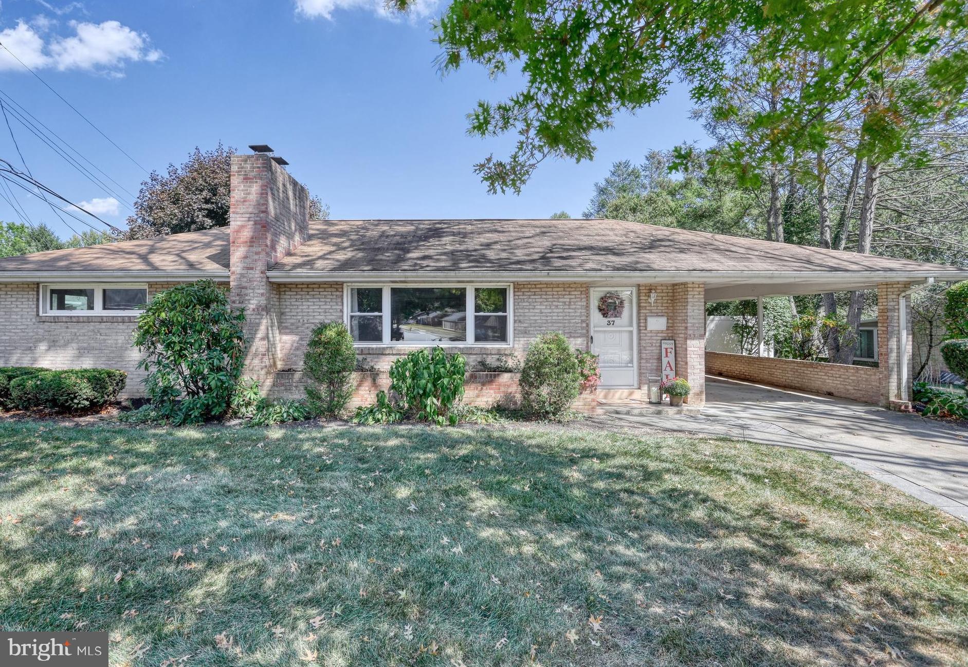Charming brick rancher in the heart of Camp Hill with incredible curb appeal! Step outside to a massive, level, fully fenced backyard—your own private oasis—featuring a screened 10x18 porch, concrete patio with raised stone border, firepit, and storage shed. Inside, the open-concept floorplan shines with an updated kitchen offering white cabinetry, granite countertops, stainless steel appliances, tile backsplash, oversized sink, and a gas stove with griddle. The cozy living room boasts a wood-burning fireplace, LVP flooring, and a bay window that floods the space with natural light. Three bedrooms and a full bath with tile surround complete the main level. The finished basement provides versatile living space for a home office, playroom, or gym, plus a utility room with abundant storage and utility sink. Updates include replacement windows, fresh paint, new doors/trim, newer water heater and water softener system, and energy-efficient gas heat. Parking is a breeze with a driveway, carport, and convenient extra parking nearby. School bus stops directly across the street. This well-maintained home offers both comfort and function—don’t miss it, this is one you’ll want to see. Call today to schedule your own private showing!