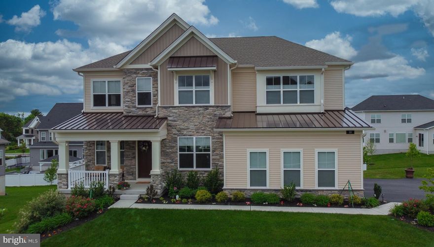 Welcome to this exquisite home, surpassing the allure of new construction. Boasting just two years of age, this distinguished 5-bedroom, 4 1/2-bathroom home is enriched with over $170K in opulent upgrades. A welcoming garden pathway that leads you to a warm and spacious covered front porch provides a cozy seating to enjoy a morning coffee, a cool drink or a place just to relax. From the moment you step inside, you'll be captivated by the meticulous attention to detail evident in every corner. As you enter the foyer, a sense of grandeur envelops you, unveiling an expansive open floor plan that beckons exploration. To the right, the formal dining room exudes elegance with its tray ceiling and recessed lighting, seamlessly flowing into the great room adorned with an efficient direct-vent gas fireplace and a majestic wall of windows that bathe the space in natural light. The heart of the home, the kitchen, stands as a testament to luxury living. A colossal island, accommodating up to five, anchors the space, complemented by top-of-the-line stainless steel appliances, including a convection/microwave wall oven combo and a 36” 6 burner gas stove accommodated with high capacity exhaust hood. In addition to the appliances, the kitchen is complemented with upgraded 42” wall cabinets and pull out drawers in all base cabinets. A vast walk-in pantry and a sunlit breakfast room with sliding glass doors complete this culinary haven. Adjacent to the family room, an additional sitting area offers a serene retreat for relaxation or entertaining. The first floor also hosts a generously-sized bedroom, currently utilized as an office, with an ensuite full bath and walk-in closet, catering to guests who prefer ground-level accommodations. Ascending the staircase, a loft awaits on the second floor, ideal for additional office space or leisurely pursuits. The master suite epitomizes luxury with its tray ceiling, oversized walk-in closet, and spa-like ensuite bathroom featuring his and hers sinks and a deluxe shower for two. Three additional spacious bedrooms, one with an ensuite bathroom and the other two sharing a Jack and Jill bathroom, each boasting a walk-in closet, provide ample accommodations for family and guests. For further entertainment possibilities, the finished walk-out basement beckons with sliding glass doors leading to the outdoors. With a rough-in for a future full bathroom, this versatile space presents endless opportunities, including the potential for an in-law suite with its separate entrance. Crafted with meticulous attention to detail, this home radiates pride of ownership at every turn. Nestled in a welcoming community mere minutes from downtown Phoenixville and offering easy access to amenities and major routes, this is an opportunity to enjoy the benefits of new construction without the wait. Welcome home to luxury living redefined.