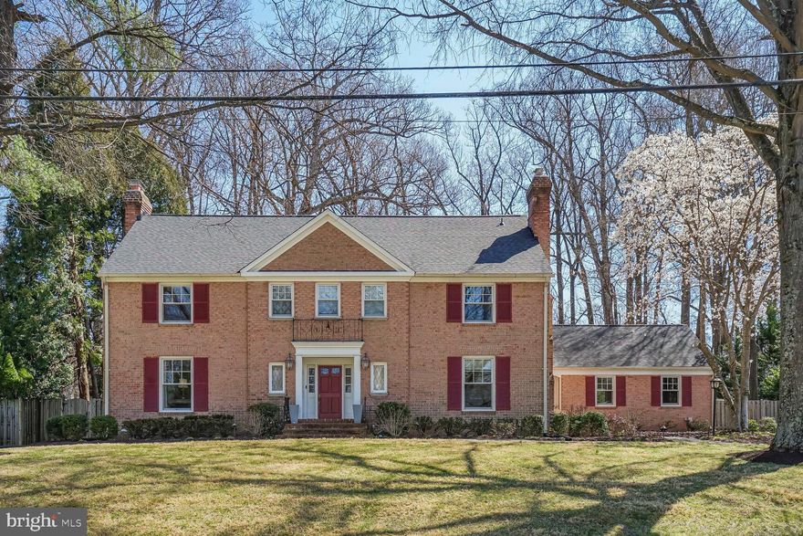 Located on one of Bethesda’s most coveted streets and backing to Burning Tree Country Club, this expansive 7-bedroom, 5.5-bath Colonial blends timeless charm with generous living space across four levels.

The main level features hardwood floors throughout, including elegant herringbone detailing in the foyer. Formal living and dining rooms are ideal for entertaining, and the large kitchen with island and eat-in area flows into a vaulted-ceiling family room flooded with natural light. A private first-floor office and attached two-car garage offer added convenience.

Upstairs, the second floor hosts four spacious bedrooms and three full baths, including a serene primary suite with a recently renovated, spa-like bathroom and dual walk-in closets. The third level includes three additional bedrooms and a full bath—perfect for guest rooms, offices, or creative spaces.

The finished basement includes a stylish built-in bar, a full bath, and a large storage/utility room. Outside, enjoy a fully fenced, beautifully landscaped backyard with mature trees and direct views of the golf course. New roof!