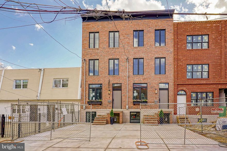 ** 1 UNIT is still AVAILABLE ** Ask for VIDEO TOUR and professional PHOTOS ** Welcome to your thoughtfully crafted new construction home in Fishtown’s Adaire catchment. 1 YEAR WARRANTY included. Ask about the 10-YEAR TAX ABATEMENT! This spacious home sits on a deep lot along a quiet side street, offering 3 bedrooms, 3 full bathrooms, and two bonus rooms—perfect for guest accommodations, an office, or a gym. The design blends classic Philadelphia charm with modern elements, featuring premium earthy finishes. Among its contemporary amenities are expanded driveway parking (pre-wired for EV charging), multiple private outdoor spaces, and ample storage.This location is prime for you to enjoy everything Fishtown has to offer. Explore a variety of restaurants, bars, shops, cafes along Frankford and Girard Avenue. The waterfront is just a quick walk away, providing more parks and entertainment options. You’ll also find a wealth of dining and entertainment in Northern Liberties and Old Kensington nearby. Less than a block’s walk is Adaire Elementary School, along with the Fishtown Recreation Center, Community Library, and Lederer Pool. Plus, you’re close to Fishtown Montessori School, PlayArts, and a sprayground. For easy commuting, you have quick access to Highway 95, the Ben Franklin and Betsy Ross Bridges, Philadelphia International Airport, and the Market-Frankford Blue Line, which connects you to Old City, Center City, and other areas. Complementing this desirable location are the classic exterior features of the home including a red brick facade and black double casement French windows beneath a stylish black cornice. An elevated front entrance enhances privacy for the main living level. Inside wide plank French oak floors spread across an open layout connecting the living and dining areas to the gourmet kitchen. Desirable natural light consumes the entire home from the front and rear. Soft recessed lighting and curated fixtures throughout offer versatile options, from bright and functional to warm and ambient. For added efficiency, this home is furnished with two HVAC systems. Designed for both functionality and aesthetics, the kitchen features GE Café appliances, a 36” professional gas range, and quartz countertops with matching backsplash. Mounted over the oven is a custom 42” hood flanked by soft lighting sconces and a long spice shelf. The kitchen island offers a deep sink and a place to sit or prep. Ample cabinetry, including three built-in pantries and a closet with opaque glass doors, ensures optimal storage. Through the sliding doors, the spacious deck is perfect for outdoor dining and comes equipped with a gas line for grilling. A grassy area off the deck can be used for pets, a small garden and/or entertaining. The finished basement provides additional living and storage space including two separate rooms each with their own closets and egress. In the hall, a full bathroom is finished with an Italian tile walk-in shower and oak vanity. Leading upstairs, the floating oak staircase is well-lit by recessed tread lights. There are two bedrooms on this floor, including a walk-in closet in the front room. All bedrooms above grade have generous windows allowing in plenty of natural light. The hall features a full bath finished with Italian tile, a deep-set tub and shower, textured porcelain floors, and an oak vanity. Additional features include a built-in laundry closet and a separate linen closet. On the third floor, the primary suite showcases opaque French glass doors leading through the custom organized closet into a spa-like bathroom. Double doors open to an oversized 71” soaking tub against a full wall of Italian tile. The bathroom also features a tiled walk-in shower with bench, separate toilet room, double sink vanity, and a linen closet. Enjoy stunning unobstructed views of the Philadelphia skyline from your spacious roof deck. Buyers are responsible for verifying taxes and square footage.