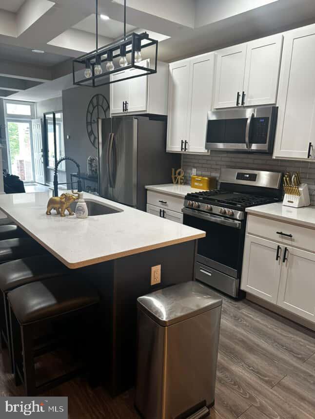 Step into your modern Baltimore oasis—where style meets comfort. This beautifully renovated home welcomes you with an open-concept main level, ideal for entertaining. Enjoy a designer kitchen with stainless steel appliances, a large quartz island, custom cabinetry, and a striking backsplash that adds a touch of elegance. A spacious dining area and convenient half bath complete the main floor, all framed by charming exposed brick walls.
Upstairs, you’ll find three sun-filled bedrooms and a spa-inspired full bathroom, perfect for unwinding. The fully finished basement offers even more space, featuring a fourth bedroom, a second full bath, a large laundry room, ample storage, and a flexible entertainment area—perfect for movie nights or hosting guests.
Don’t miss the opportunity to make this stunning home yours—schedule a private tour today and experience modern Baltimore living at its finest.
