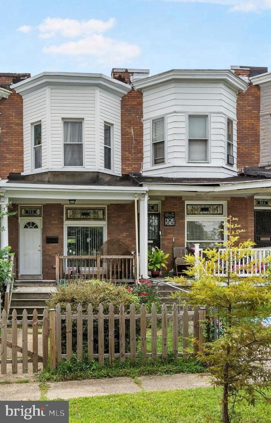 This well maintained porchfront home with parking in Irvington is a great opportunity to purchase as your new home or investment property!  Tenants have rented for the past 4 years and are now on a month to month lease at $1,400 per month. This spacious home features an open floor plan with classic brick accent wall, decorative transom windows over the front window and door, original refinished hardwood floors in the living and dining room, and tile flooring in the country kitchen with lots of cabinet space and gas cooking.  Upstairs the Primary’s bedroom is spacious and bright with large bay bow windows with bench seating, and a large closet.  There are 2 more bedrooms upstairs, one with a skylight, and a full bathroom in the hall with shower and tub combo. The lower level is unfinished with laundry and lots of room for storage. Outside you can enjoy your morning coffee on the covered front porch, or hosting barbecues on your back deck and in the fenced in backyard.  Parking is convenient in the parking pad behind the house. Located close to shops, restaurants, and commuter transportation, and Rte, 40, 83 and 95. Don’t wait, schedule your tour today!