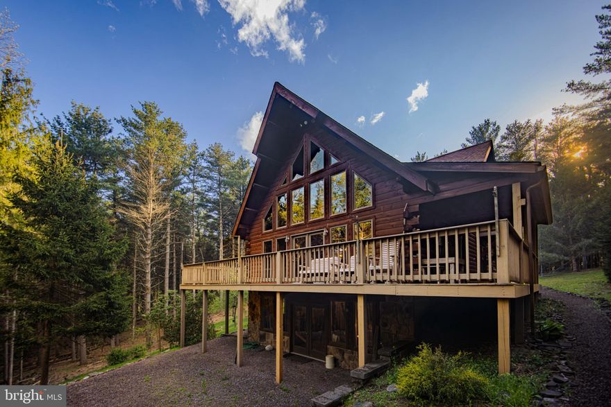 Welcome to your dream retreat! This meticulously maintained 3-bedroom, 2-bathroom chalet offers a perfect blend of comfort and nature, set in a truly private setting just a short stroll from New Germany State Park.

As you approach, you'll be enchanted by the inviting wrap-around porch that provides stunning views of the lush landscape and local wildlife – a true nature lover's paradise. Step inside to discover an open-concept living space bathed in natural light, featuring modern amenities, high-quality finishes, and a cozy atmosphere.

For your convenience, this home boasts a spacious 2-car garage and essential central air conditioning to keep you cool during the warm months. Enjoy peace of mind with a whole home generator, ensuring you're always ready, no matter the weather.

The property is a horticultural delight, with abundant blueberry bushes and apple trees perfectly situated on the grounds, offering fresh produce right at your fingertips. The walkout basement leads you to a charming firepit area, perfect for cozy evenings spent with family and friends under the stars.

This home can convey "turn-key," complete with everything needed for you to move in on day one or to cater to Airbnb guests with ease. Don't miss the unparalleled opportunity to own this beautiful chalet that combines luxury living with the beauty of nature! Schedule your private tour today and experience the tranquility this unique property has to offer.