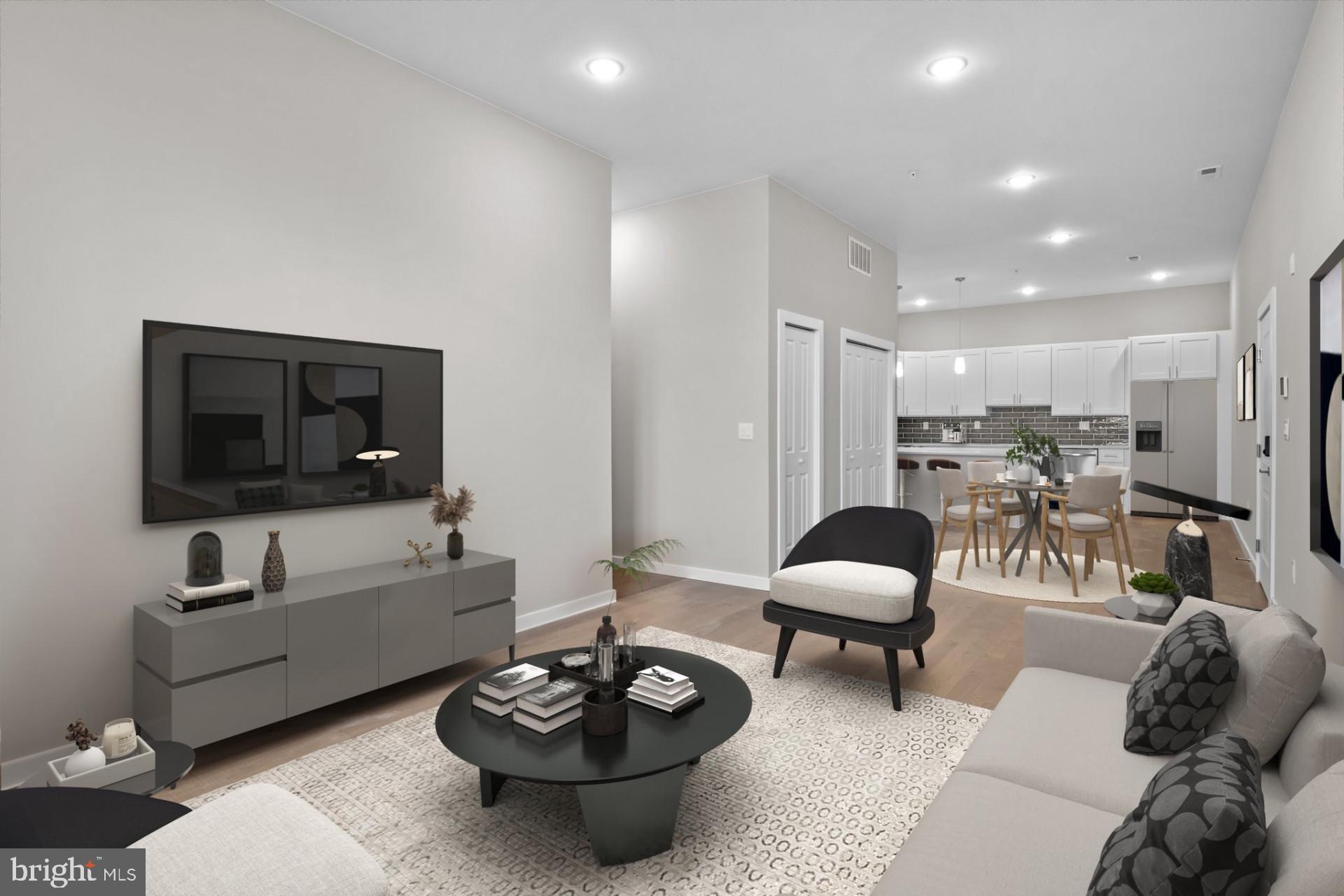 Welcome to Historic Bristol Boro and Jefferson Planned Community! Don't miss on new luxurious condo units in Historic Bristol Borough. This impressive 1472 sq ft., 3-bedroom unit features an open floor plan, 10’ feet ceilings, hardwood floors throughout and LARGE STORAGE UNIT in a basement. The open-concept design is curated for seamless entertaining, with a layout that effortlessly flows from the kitchen to the living area. The Living Area has an abundance of natural light through the large windows. Thoughtfully designed, this floor plan features 3 graciously sized Bedrooms and two Full Bathrooms. The kitchen has white cabinetry with quartz countertops, a tile backsplash, stainless appliances, wine cooler and a peninsula separating the dining area. There is a large laundry room off the hallway with porcelain tile floor. Bathrooms feature modern vanities, porcelain tiles and plenty of space. This large units offers 3 bedrooms and 2 full baths. The master suite showcases a spacious bedroom, private bath and walk-in-closet. The private bath has a beautiful custom tile shower with a glass enclosure, double bowl modern vanity and porcelain tile on the floor. The hall bathroom complements the master bathroom with similarly impressive tile and fixtures. This unit has LED recessed lighting throughout, electric heater, central A/C, vinyl double-hung windows and comes with 2 assigned parking spaces. The HOA parking lot also offers additional 8 visitors parking spaces for residents' guests. This beautiful new unit located in the middle of Historic Bristol Borough, close to Mill Street and the riverfront, and just a few blocks to the baseball fields and recreation area.