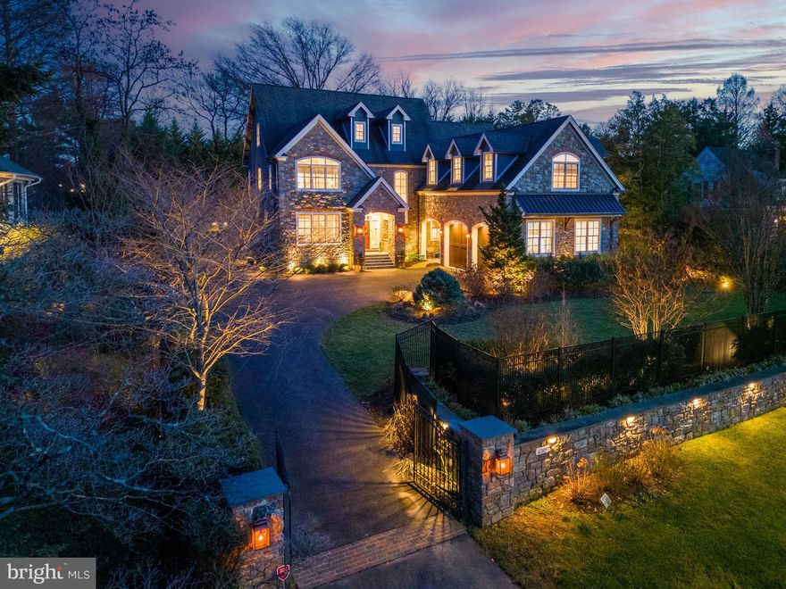 Introducing Philadelphia Magazine's 2014 Design Home; an exquisite 7300 sq. ft. residence fashioned from Wissahickon schist stone, gracing one of Wyndmoor's most coveted addresses and is cited across from the legendary Wharton Sinkler Estate. This manor home, meticulously crafted with the finest materials and possessing exceptional appointments and finishes, epitomizes grandeur while embracing an open floor plan tailored for a care-free lifestyle that today’s discerning buyers are seeking. This design home exudes timeless elegance, offers unparalleled craftsmanship, state-of-the-art Smart Home technology and features an elevator for all floors. Enter through a magnificent grand foyer adjoined by an inviting and generously proportioned great room and dining room.  The gourmet chef's kitchen is a culinary haven, featuring custom Plain & Fancy cabinetry, Carrera marble countertops and backsplash, dual Sub-Zero stainless steel refrigerators, a 6-burner Wolf gas stove, dishwasher, and eye-catching island, perfect as a gathering spot. A separate catering kitchen/butler’s pantry is complete with Wolf appliances and a sink and ready for seamless entertaining. The sun-drenched, dramatic two-story family room is accented by a stunning gas fireplace, inviting warmth indoors and outdoors through a 16’ full-view folding door. This floor also offers a well sized home office with a wall of built-ins. Lastly, there’s a den/study featuring an adjacent powder room. A stunning turned staircase with accented Palladian window leads to an equally remarkable second floor.  The homeowner will enjoy a 1,000 sq.ft. primary suite sanctuary. This retreat features a breakfast bar, two expansive walk-in, windowed and entirely outfitted closets, and a spa-inspired bathroom with radiant heated floors, a sauna, dual vanities, separate water closet and one-of-a-kind walk-in shower, and a soaking tub. An unparalleled view of distant fields enhances the ambiance. The second floor also offers three additional bedrooms, one with an en suite bath and the others are serviced by a popular Jack-n-Jill bath, and is completed by a conveniently located laundry room. Additionally, the property features a third floor which can serve any number of purposes, including a bedroom or possible game room/media room/playroom and is completed by a full bathroom, an additional 810 sq. ft.  of living space. The interior further features a 1,300 sq. ft. lower level showcasing a large recreation room accented with a handsome wet bar,  at-home gym/yoga room, and a guest suite perfect for an au-pair or visiting friends and family with full bathroom, a second laundry room, powder room, ample storage, and light-filled sliding doors opening to a hot tub. The exterior features meticulously designed custom landscapes, with an outdoor Pennsylvania blue slate terrace, an outdoor wood-burning fireplace under a covered porch, a built-in fabulous outdoor kitchen, and a splendid custom garden pool with an abundance of outdoor accent lighting an oasis for grand scale entertaining or just a simple spot for some rest & relaxation and offers a seculded setting.  An oversized two-car garage, with a separate side entrance leading to a family entry/mudroom complete with custom built-ins, benches, beaded board and third powder room completes this exceptional residence. The property is well situated and easily walkable to Chestnut Hill offering endless shopping and dining destinations. The location makes for easy commuting to Center City Philadelphia and offers easy access to a number of major roadways. Enjoy Springfield Township Schools as well as a host of well regarded private schools. Opportunity is knocking for its next lucky buyer!
