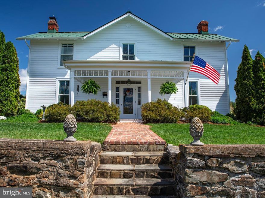 Welcome to a delightful 12± acre riverfront property designed for those who love to garden, entertain, and enjoy the beauty of nature. With Robinson River frontage, a shared pond, and vibrant landscaping across two separately deeded lots, this property offers the perfect balance of inspiration and ease for hobbyists and green thumbs alike.

The restored c.1870s farmhouse blends classic charm with modern comfort. The 3-bedroom, 2-bath home is filled with natural light and offers water views from nearly every window—from the peaceful flow of the river to the tranquil pond just beyond the rear deck. Inside, bright and cheerful living spaces make it easy to feel right at home.  A two-car garage with a conditioned bonus room above adds flexibility for a studio or hobby room.  The detached wine tasting room  offers a peaceful spot to relax, create, or work from home.

At the heart of the second lot is a wonderful entertainment barn, complete with a workshop and expansive canning kitchen—the perfect space for preserving the garden’s bounty or hosting casual get-togethers with friends. 

Below the barn is a two-car garage providing ample storage for tools, equipment, and garden gear.

Step outside into an inviting landscape where colorful gardens and raised beds offer space to grow vegetables, herbs, or your favorite flowers.  A charming greenhouse extends your growing season and gives you a sunny place to start seedlings or pot plants.  You can even have several chickens!

Enjoy relaxing walks by the river, listen to the gentle sounds of the water cascading over the rocks, and savor the slower pace of life surrounded by natural beauty.

Whether you're an enthusiastic gardener or just getting started, this charming property offers room to grow!