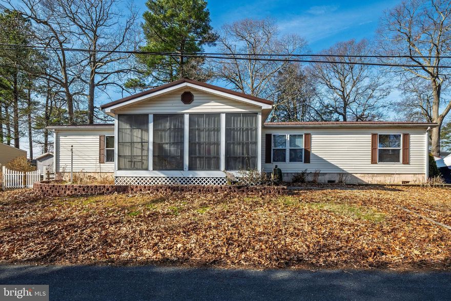 MOTIVATED, BRING AN OFFER!!! REDCUED, LETS GO!!!  BRING AN OFFER, LETS CHAT!!!!  Welcome to 25858 N Cherry Street, Millsboro de 19966!!!  This great home is in popular Bay City community that is located on the Rehoboth Bay!!!  This 1901 square foot home features 3 nice size bedrooms, 2 full bathrooms, a living room, dining area and family room.  The kitchen has oak cabinetry and white appliances.  All appliances come with the home including the washer and dryer.  The roof is newer and is a metal roof.  The best part of the home is the nice porch area with windows that slide up and down.  The deck is off the back of the home for more entertaining space.  This home does have a land lease that is $778 monthly.  The community has great boat slips for seasonal rental, playground, beach area and tennis courts.  This home can be lived in year-round, or for summer usage only.  Add some new paint and make this lovely home shine.