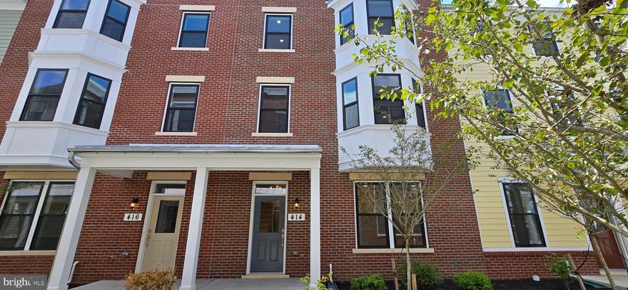 ONE OF A KIND RENTAL — Welcome to Frederick’s newest crown jewel, Chapel Alley! This end-unit, new construction, 3-story townhouse—the largest in Frederick—offers a rare opportunity for luxury living in the heart of picturesque Downtown Frederick, just steps from the city’s best dining, shopping, and entertainment. No detail was overlooked and no expense spared in crafting these one-of-a-kind homes. The striking exterior features red and black brick, composite black casement windows, custom iron railings, galvanized gutters, full divided light doors, and Hardie plank siding. Enjoy two private parking spaces, a fenced backyard, a utility balcony, and professional landscaping. Inside, the open-concept layout is anchored by a chef’s kitchen with natural quartzite stone countertops, a waterfall island, double oven, cooktop, built-in refrigerator with craft ice, and custom cabinetry with glass accents and built-ins—including a dedicated stone-topped kitchen desk. The adjacent dining and family room showcase a dramatic fireplace surround and built-in storage, with a balcony for fresh air just steps away. The primary suite features dual custom closets, a Juliette balcony, and a spa-like bath with natural black stone countertops, a black soaking tub, dual shower heads, and designer lighting. All baths feature floor-to-ceiling designer tile and premium fixtures. The top-level penthouse, with its own mini-split, includes a built-in bar, half bath, and sweeping views. This is Downtown Frederick luxury living at its finest—spacious, stylish, and truly one of a kind.