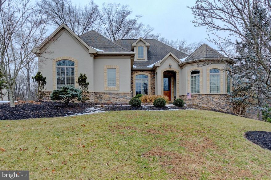 Right Sizing, Down Sizing or just starting your search. Look no further! This beautiful Roland Builder Model Home is calling your name. With the neighbor's purchase of an additional 13 acres of  land behind, there will not be those nosey neighbors behind you. There have been no details undone. Timeless details throughout. From the 9'+ ceilings, gorgeous crown molding, exquisite trim, elaborate wainscotting, vaulted ceilings, a double sided fireplace, you will always impress your family, friends and guests. This 4 bedroom, 3 bathroom home has been meticulously taken care of. Main Floor living at it's finest! The Kitchen boasts a Sub Zero Refrigerator, Wolfe Gas Cooktop and Double Wall Ovens, Granite Countertops, Tile Backsplash, Large Island, and is open to the Breakfast Area. The bright Sunroom is just ahead. The flow is perfection, making entertaining a breeze! The Great Room is also open concept and boasts a Stunning Stone Double-Sided Fire Place. Tucked away, off the Great Room, is the Owner's Suite. With a beautiful vaulted ceiling and En Suite boasting an exquisite Walk-In Tile Shower, two Vanities with Corian Countertops, Jacuzzi surrounded by Tile, and two Walk-In Closets, you will think you found paradise!  The Dining Room is a work of art, with elaborate Wainscotting and Hardwood Floor. Two nicely sized Bedroom and the Main Bath finish the main floor.  The finished basement features two nicely sized Storage Areas with Epoxy Floor, the forth Bedroom, Full Bathroom, second Great Room, and a Gym. The Attached two car Garage features Epoxy Flooring and Built-In Cabinets. So much to see! Schedule your showing today.