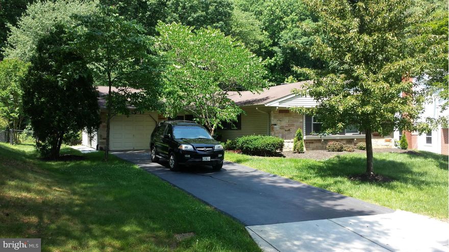 BEAUTIFUL RANCHER! Recently renovated with a sunroom addition off of the back.  New kitchen cabinets, Stainless steel appliances, ceramic tile, new flooring and paint and much more.  Backs to woods for such a picturesque and private setting!