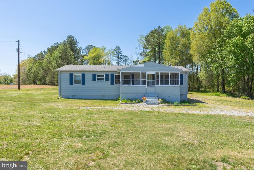 Welcome to 18116 Passing Road in Caroline County. This 3 bedroom 1.5 bath home is nestled in 12.45 acres. As you enter through the front you will pass though the sunroom that overlooks the serene front acreage. This home also features an eat-in kitchen, formal living room, in addition to the 3 bedrooms there is a bonus room that can be utilized as a 4th bedroom, office, playroom, or nursery. The exterior offers 2 storage sheds and a large carport If you have been looking for a secluded property that you can add sweat equity to, this one is for you! Don’t miss out on this wonderful opportunity in Caroline County.