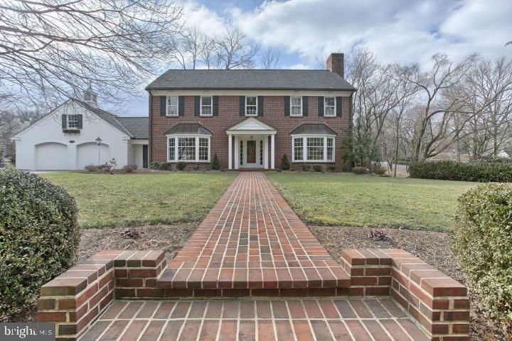 This Stately/Classic Brick Two Story Home Boasts An Elegant Center Hall w/Beautiful Curved Staircase, Hardwood Floors, Bay Windows, Spacious Rooms. LR & FR Fireplaces*29x16 Sunny Kitchen-Viking Cooktop-Tile Backsplash-Flagstone Floor*Formal Dining Room Bay Window*Living Rm Fireplace&Bay Window*New Screened-In-Porch w/Cathedral Ceiling&New Flagstone Patio for Outdoor Entertaining*