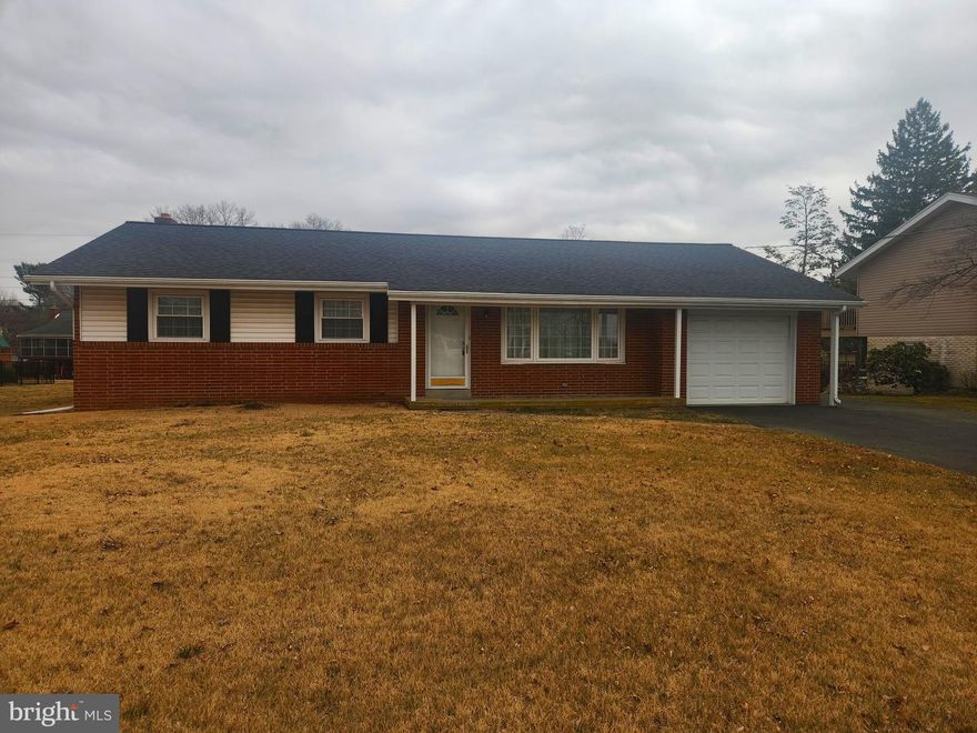 This property will be offered at Public Auction on Thursday, April 24, 2025 @ 6pm.  The listing price is the opening bid only and in no way reflects the final sale price.  10% down due at auction, 2% transfer tax to be paid by the purchaser, real estate taxes prorated. This brick ranch home, nestled in a great neighborhood, offers convenient access to both Route 283 and 30. The main floor of this home features a cozy living room, a kitchen, a formal dining room, three bedrooms, a full bathroom, and a laundry space. The unfinished basement hosts a large open area with a brick fireplace, offering lots of potential for a finished space! Additional amenities include an attached 1-car garage and a large backyard.