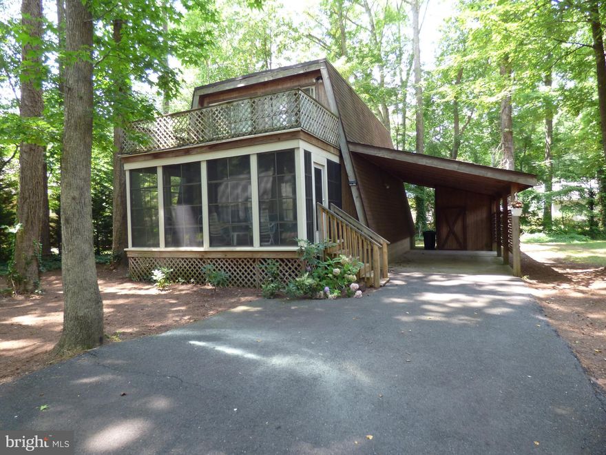 Get away from it all in this cute-as-can-be fully furnished Chalet style home!  Relax outdoors on the vinyl- tech/screened porch, rear patio, or upstairs on the balcony! The primary bedroom is located on the first level, and there are three additional bedrooms upstairs.  Plenty of cabinets in the kitchen, as well as a pantry for storage. The sizable mud room makes doing laundry a breeze! There is even a covered carport with attached storage shed. Located in the award winning Ocean Pines community!