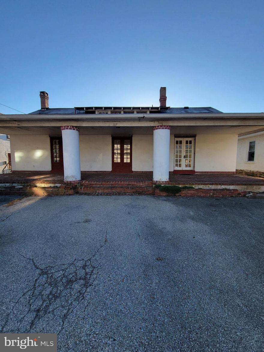 This property is not pet friendly.  This adorable, old with character bungalow is a mix of renovated upgrades and old world charm.  This home is surprisingly large and don't let the outside fool you.  When you pull up to the property, you have off street parking right in front of the house.  Step up unto the brick patio where you will enter through the door to the right.  These are original doors and create such character.  When you open the door you will be in the Living Room which is enormous!  The fireplace is just decorative now, but was left to keep the charm of the home. If you go straight ahead, you will see the very nice sized Dining Room which leads directly into the newly renovated kitchen.  It has plenty of cabinets and countertops and has access out to the back yard which gives you extra space for entertaining.  The hallway will lead you to the first of two full bathrooms, both with tubs.  After the hallbath, you will come to the Primary bedroom on the left, complete with it's own Primary bath.   The next room is the 2nd bedroom which has such natural light and is of nice size followed by the 3rd bedroom.   There is no upstairs or basement in this unit.  Plenty of closet space through out and check out the knobs on the doors.  Such character.  Landlord is looking for all applicants over 18 to have a credit score of 600 or more, with no criminal background.   This is a month to month lease. NO PETS!