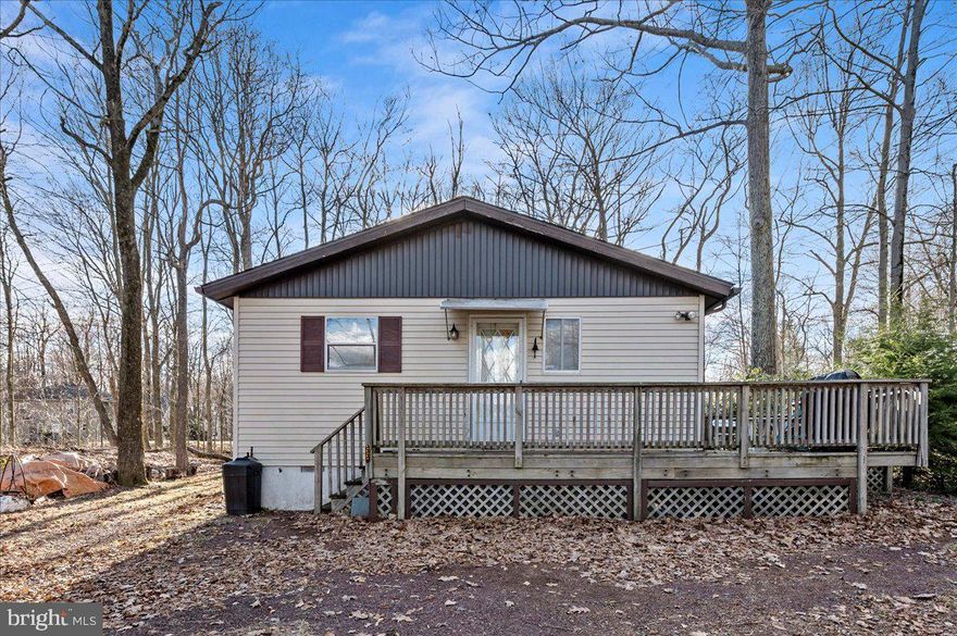 Welcome to the Poconos! This cozy and charming single level home is the perfect place to settle in, whether you're looking for a full time residence, a weekend escape, or even a smart investment. With a layout that flows easily from room to room, you’ll feel right at home the moment you walk in. The living area is bright and welcoming, filled with natural light that gives the whole space a cheerful feel. The kitchen has plenty of counter space for cooking, prepping, or just hanging out while meals are being made. There's also a separate dining area that’s great for family dinners, game nights, or entertaining friends. With three comfortable bedrooms and two full bathrooms, there's room for everyone to spread out and relax. Outside, the home sits on a quiet road surrounded by trees and nature, offering a peaceful, tucked away vibe, yet you're still close to all the fun and adventure the Poconos has to offer. From hiking and fishing to skiing and boating, there’s something to enjoy in every season. Whether you’re sipping coffee on the front porch or heading out to explore the area, 108 Bradley Road is a place that feels like home the moment you arrive.