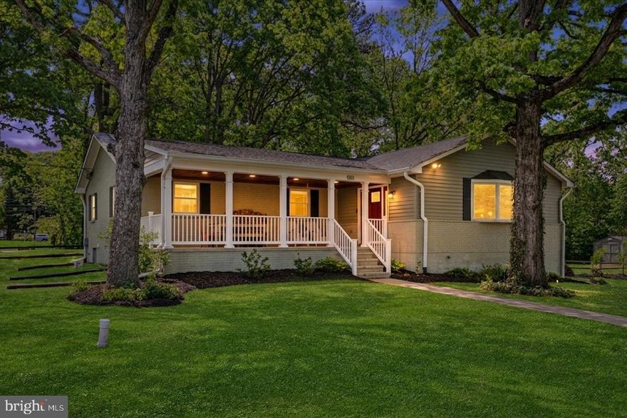 Beautifully renovated ranch-style home on a premium corner lot in a quiet neighborhood, just minutes from Elvaton Park and Kinder Park Farm. Enjoy the charm of a southern-style front porch with a stained wood ceiling, perfect for relaxing afternoons. Gleaming hardwood floors flow throughout the main level, complemented by tile in the kitchen and bathrooms. The kitchen features warm-toned cabinets, granite countertops, and stainless steel appliances. The finished, waterproof lower level includes a spacious family room with a sump pump and battery back-up. Step outside to a deck overlooking a fully fenced backyard with a storage shed, ideal for entertaining or hobbies. Includes an attached garage. Zoned for Severna Park High School, with recent updates including a new water heater and washer and dryer.