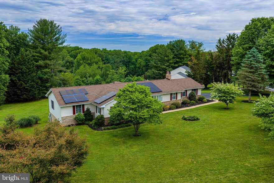 Welcome to 14300 Carroll Ridge Ct in desirable Baldwin—an incredibly unique, oversized rancher offering space and flexibility. Situated on 1.22-acres this property is designed for those seeking a more spacious, spread-out setting while still enjoying a sense of community. With multiple thoughtful additions over time, this home presents a rare opportunity for multi-generational living or for anyone simply wanting room to spread out and enjoy.

From the moment you step inside, you’ll appreciate the immaculate condition and modern updates. The stunning kitchen renovated just 2–3 years ago, featuring cream cabinets, granite countertops, stainless steel appliances, a large island, a built-in pantry with electric, roll-out shelving, under-cabinet lighting, classic subway tile backsplash, and staggered tile flooring—all with a seamless sightline into the expansive family room.

The family room is filled with natural light and anchored by a double-sided gas fireplace that connects to a versatile flex space—perfect as a dining room, office, playroom, breakfast area, or den. Just beyond, a stunning sunroom with vaulted ceilings, walls of windows, a slider to the outdoors, and another gas fireplace creates a bright and inviting room for relaxing or entertaining.

This home features two spacious primary suites, offering incredible flexibility. The main primary suite includes a generously sized bedroom with an electric fireplace (complete with realistic crackling sound), and a large ensuite bath with walk-in shower, soaking tub, oversized vanity, and convenient laundry. The second oversized primary suite offers enough space for sitting area and its own ensuite bath with walk-in shower. The third bedroom on the main level is also well-sized.

The lower level has a large recreation room with a third gas fireplace...a fourth bedroom (with an ensuite) that could easily serve as a home office, gym, poker room, or hobby/craft room....a huge storage area...and a second laundry hookup. 

The outside expands your sq. ft and is designed for entertaining and relaxing. The centerpiece is the large deck perfect for summer gatherings and the Michael Phelps H2X Fitness Swim Spa ($32,000) which offers the ultimate in-home wellness experience, combining resistance swimming with hot tub therapy—perfect for morning workouts or relaxing under the stars and country sky.  The bluestone patio and stone walkways further enhance your outdoor space. 

Additional features include refinished hardwood floors throughout the main level, some fresh paint, plantation shutters, recessed lighting, spacious closets, Anderson windows, crown and chair rail molding, new rear fence (2025), and a separate outside-access storage/workshop—perfect for hobbies, projects, or additional storage—as well as a shed.

Enjoy added peace of mind with a newly installed whole house generator, major system updates already in place, including a new well pump (end of 2025), an architectural roof (approx. 8–10 years old), and a high-efficiency HVAC system (2014). Owned solar panels further enhance the home’s efficiency, helping to keep BGE bills low.

Conveniently located close to Hunt Valley and Bel Air amenities, including Wegmans, and offering easy access to I-95, I-83, and 695 commuting routes—this home delivers the perfect balance of convenience and lifestyle, all while enjoying the privacy and charm of a neighborhood setting tucked into the country.

Some photos are AI enhanced and staged.