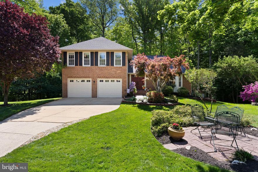 You have found your Oasis!  Situated on a quiet cul-de-sac near Lake Mercer, this beautiful home at 7710 Wilbur Court is ready to welcome you. From the moment you arrive, you’ll feel a sense of calm, where mature trees, lush landscaping and a peaceful setting create a quiet retreat. Step inside to discover sun-filled living spaces where memories are made. Warm hardwood floors, soft natural light, and thoughtful details create an inviting atmosphere that instantly feels like home. The layout flows effortlessly, offering the ideal backdrop for everything from relaxing evenings to gatherings with friends and family. The kitchen with new quartz counters and tiled back splash serves as the heart of the home, ready for morning coffee, holiday meals, and everything in between, while adjacent living and dining areas provide flexibility to suit your lifestyle. Upstairs has brand new carpet throughout and spacious bedrooms offering comfort and privacy, each one a quiet haven at the end of the day. Out back, a private yard with vibrant gardens invites you to unwind, entertain, or simply enjoy the changing seasons. Whether it’s a summer barbecue, a crisp autumn evening by a fire pit, or a quiet morning enjoying the sounds of nature, this outdoor space is full of possibility. County trails provide easy access to South Run Rec Center.  Just minutes from shopping, parks, commuter routes and top notch schools. This home offers not only a place to live but a place where your next chapter begins.