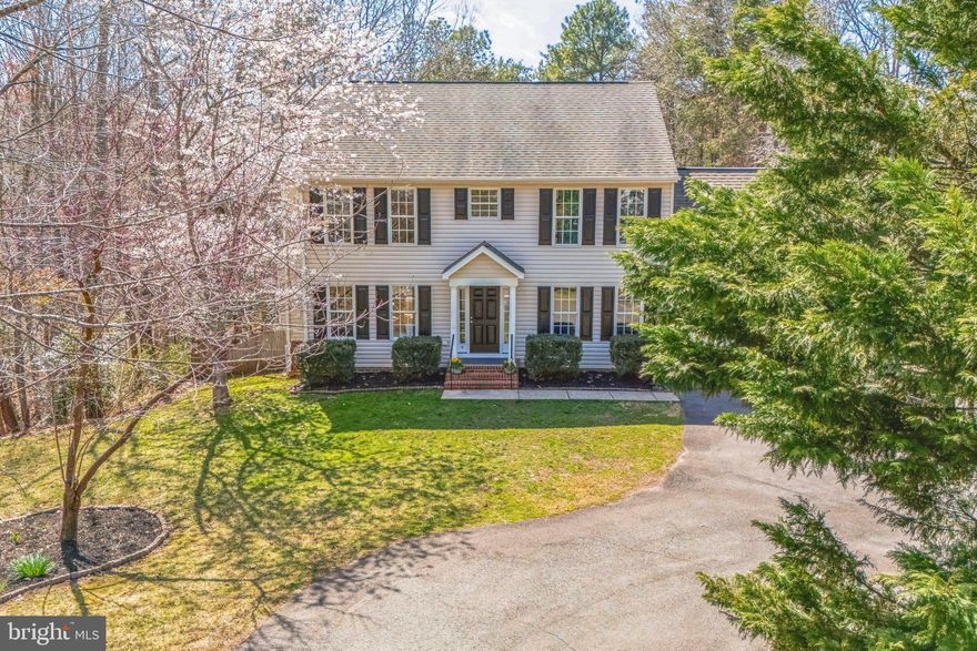 Welcome to the stunning South Woods community! This lovely 4/5-bedroom, 3.5-bathroom home spans 3004 sf. With an attached garage, a paved driveway, and a fantastic layout, this home offers ample space. Step inside to an open-concept design with a bright kitchen, eat-in area with custom built-ins, and inviting living spaces. The main level features a cozy gas fireplace in the living room, a large dining room, and an adaptable playroom/family room. The beautiful updated kitchen boasts granite countertops and newer appliances, a spacious built-in breakfast nook with storage benches, and a conveniently situated laundry room. The upper level features a primary suite with a cathedral ceiling, his-and-hers closets, and a luxurious ensuite bath with a new granite dual vanity and Jacuzzi tub. You'll also find three sunny bedrooms with a dedicated full bath. The versatile finished walkout basement offers bamboo flooring throughout, a guest bedroom/bonus room with an additional full bath, large open Exercise and Game rooms, and a spacious storage room with built in shelves. Enjoy serene views from the fenced backyard, as you step onto the expansive composite deck (2022) or relax on the gorgeous hardscape patio with a Plantation 60 cast iron firepit, built-in seating, and automated lighting (2019). Perfect for entertaining or unwinding in peace!

This home is equipped for modern living with a 2023 HVAC system featuring high-efficiency Carrier system with humidifier (recently serviced), whole-home wiring for ethernet, cable, and security system (not currently set up with a provider), Ecobee Smart thermostats with 6 sensors for precise temperature control. All newer kitchen appliances are included, and the seller’s active pest control service contract can be transferred to the new owner for added peace of mind.

The community offers a saltwater pool, tennis and basketball courts, playgrounds, and a clubhouse available for free reservations—perfect for hosting events or gatherings.

Location is everything! Just 15 minutes from restaurants, shopping, and fitness centers, and only 10 minutes from I-95 and the VRE, this home offers the perfect blend of tranquility and convenience.

Imagine cozy evenings by the fireplace, summer barbecues on your expansive deck, and unwinding on the patio as you take in the tranquility. Homes in this sought-after community don’t last long - Schedule your private tour today!