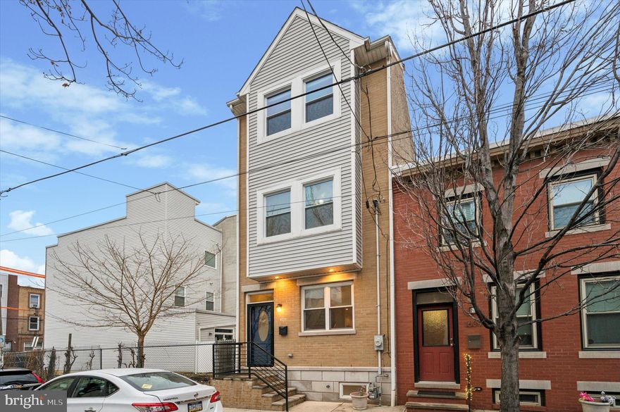 Fabulous townhouse for rent in Point Breeze! Enter into the spacious living and dining areas, which continue into the kitchen through the open layout. The chef's kitchen is complete with tall cabinetry, a center island, large pantry, granite countertops and sliding glass doors that bring extra light into the home. The first floor features hardwood flooring throughout and a coat closet. A private back patio is the perfect place for grilling and entertaining. On the second floor, there are two spacious bedrooms, with a full bath and laundry closet in the hall between the bedrooms. Both bedrooms have spacious closets. On the third floor, you'll find the primary suite with a spacious walk-in closet, cathedral ceilings and a private spa-like bath with rainmaker shower, jacuzzi tub, and double vanity. A spiral staircase leads you to a rooftop deck with expansive views of Philly's skyline. The basement is fully finished and has a half bath, creating an entire floor of additional living space. Enjoy proximity to local favorites like American Sardine Bar, Batter and Crumbs, Rosario’s Pizzeria and everything on East Passyunk Avenue just across Broad Street.