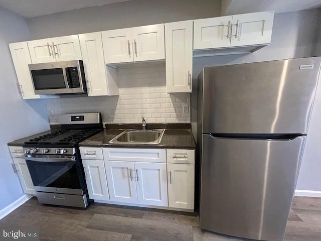 Located in the Port Richmond neighborhood of Philadelphia, 2088 E Clementine St. is a beautifully renovated home offering 2 bedrooms and 1 bathroom. The kitchen boasts white shaker cabinets, a stylish tile backsplash, and plenty of counter and cabinet space. Brand-new stainless steel appliances will be installed prior to move-in.
The spacious living room flows nicely to the second floor, where you’ll find bright bedrooms with ample storage and natural light. The modern bathroom features a sleek design with a tub for added comfort. A private back patio provides a great spot to relax outdoors, and laundry hookups are available in the basement for your convenience.