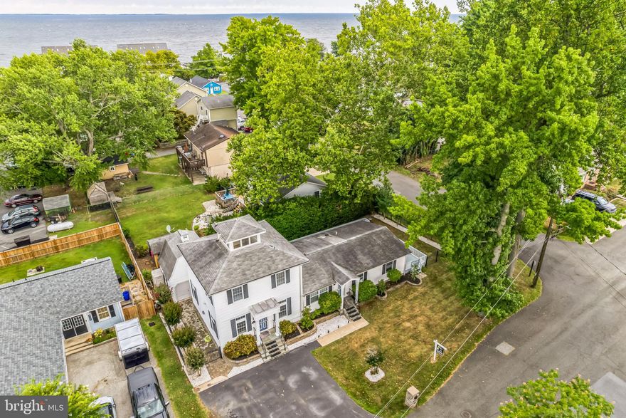 Absolutely Fantastic House in Chesapeake Beach within walking distance to Chesapeake Bay boardwalk, restaurants, bars and shopping!  If you want a house that feels like you are on vacation everyday, this is it.  Year round vacation style  living.  House has 4 bedrooms with 3 full bathrooms.  The 2 story addition has a stunning great room that you have to see.  The owner's suite has a full bathroom, sitting area with spiral staircase up to widows peak with views of the Chesapeake Bay.  The single story addition has an awesome kitchen with granite counters, stainless steel appliances with separate dining area.  The single story portion of the house has 3 bedrooms with the 3rd full bathroom.  House has detached garage with additional walk around storage above the garage.  This property is eligible for 100% financing with a USDA loan.  Great opportunity!!