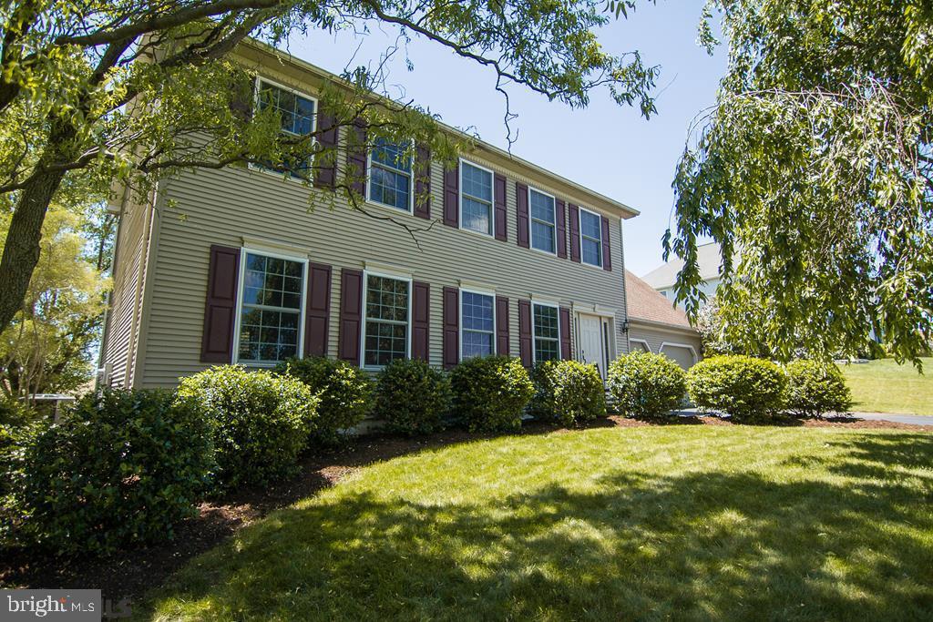When quality counts!  This strikingly upgraded home is sure to impress.  From cherry wood and tile floors and high-end plush carpeting, to crown molding throughout the house and top-notch hardware & fixtures, there's much to like. The luxury kitchen boasts stainless steel appliances, granite countertops with leathered finish, solid cherry cabinetry with soft close drawers, a tile backslash, under cabinet and recessed lighting, and a big pantry.  The family room over the garage could be a fifth bedroom.  Other features include 2 Nest thermostats, many dimmer switches, surround sound wiring in the living room and family room, shadow box trim and chair rail in the dining room, a finished basement with many recessed lights and egress window, an oversized 2 car garage with epoxy floor and Craftsman rail system, and a basement work room/gym.  Outside you'll enjoy sitting on the paver patio overlooking the adjacent farm fields and admiring the nice landscaping.  A fine, top of the line home!