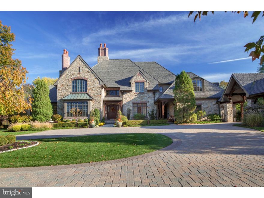 There is nothing this architectural landmark lacks. From mechanicals to aesthetic charm, this property represents the truly high water mark for design and finish and high quality living. Drive by once and you will always remember this striking home's design. The sweeping drive leads to a fine masonry masterpiece. European influenced exterior design includes pebble and dash, stone, brick and solid timber features. Nestled among the most prestigious homes built over the last 20 years, this house is remarkable for its individual style and grace. The site allows a southern exposure to the rear "living" side of the home infusing the house interior and private outside living with sunlight all day long. A separate outbuilding allows for a sequestered parking area and a private, one bedroom apartment over the spare garage. The compound of buildings also includes a sumptuous pool cottage and gardener's workhouse invoking the estate living of a bygone era. The landscape is perfectly maintained. A 62' lap pool with waterfall spa and lovely terraces embrace the private side of the property. The house plan layout is the most luxurious set of living spaces you can imagine. From a first floor master bedroom / bathroom suite including a full workout gym and private library, to the high open main family/great room, exquisite private dining room and kitchen open to breakfast table and four season sun room, the feel is one of opulence. Thick wide doors and detailed doorway openings integrated with rich mill work forming shaped ceilings with multiple steps of crown trim. Indirect ceiling lighting highlight real gold leaf and faux finishes lending a sense of excitement to every room. The heavy timbers introduced on the exterior are found again in soaring timbered trusses in the vaulted and balcony overlooks inside. Artisanship in the wood finishes from mortise and tenon ceiling beams to rich kitchen cabinets and abundant mill work built-ins abound. The Mechanicals include full radiant floor heat augmenting the duel boiler fan-coil ambient air heating and cooling.  The electronics bristle providing the hi-tech ease of sophisticated living. Endless recessed lighting, a full house sound system, security system with cameras, centralized lighting controls with command station. From a moisture proof basement design to high quality Pella windows, hand split cedar shingles and terne metal roofing with copper spouting, there is nothing this house requires for First Class living!!!