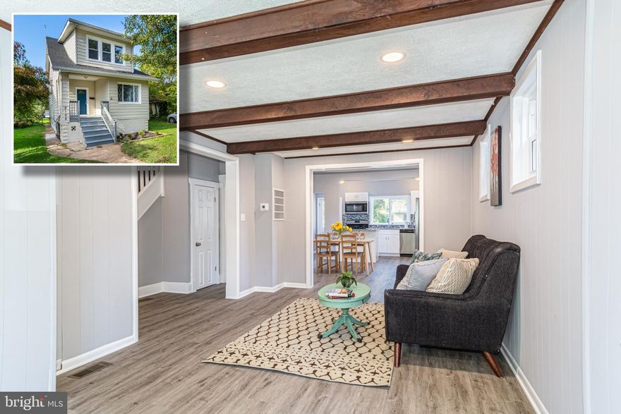 BEAUTIFULLY DESIGNED RENOVATION WITH OVER 1,500 SQ. FT. OF LIVING SPACE & OFF STREET PARKING!  Features include hardwood floors throughout the main level, an inviting living room with exposed beams, separate dining area, designer kitchen with granite counters, ss appliances, and tile backsplash, main level full bath with custom tile work, upper level with 4 bedrooms and a 2nd full bath, full basement with laundry that's perfect for storage, and a spacious rear deck overlooking the large yard with front and rear driveways!