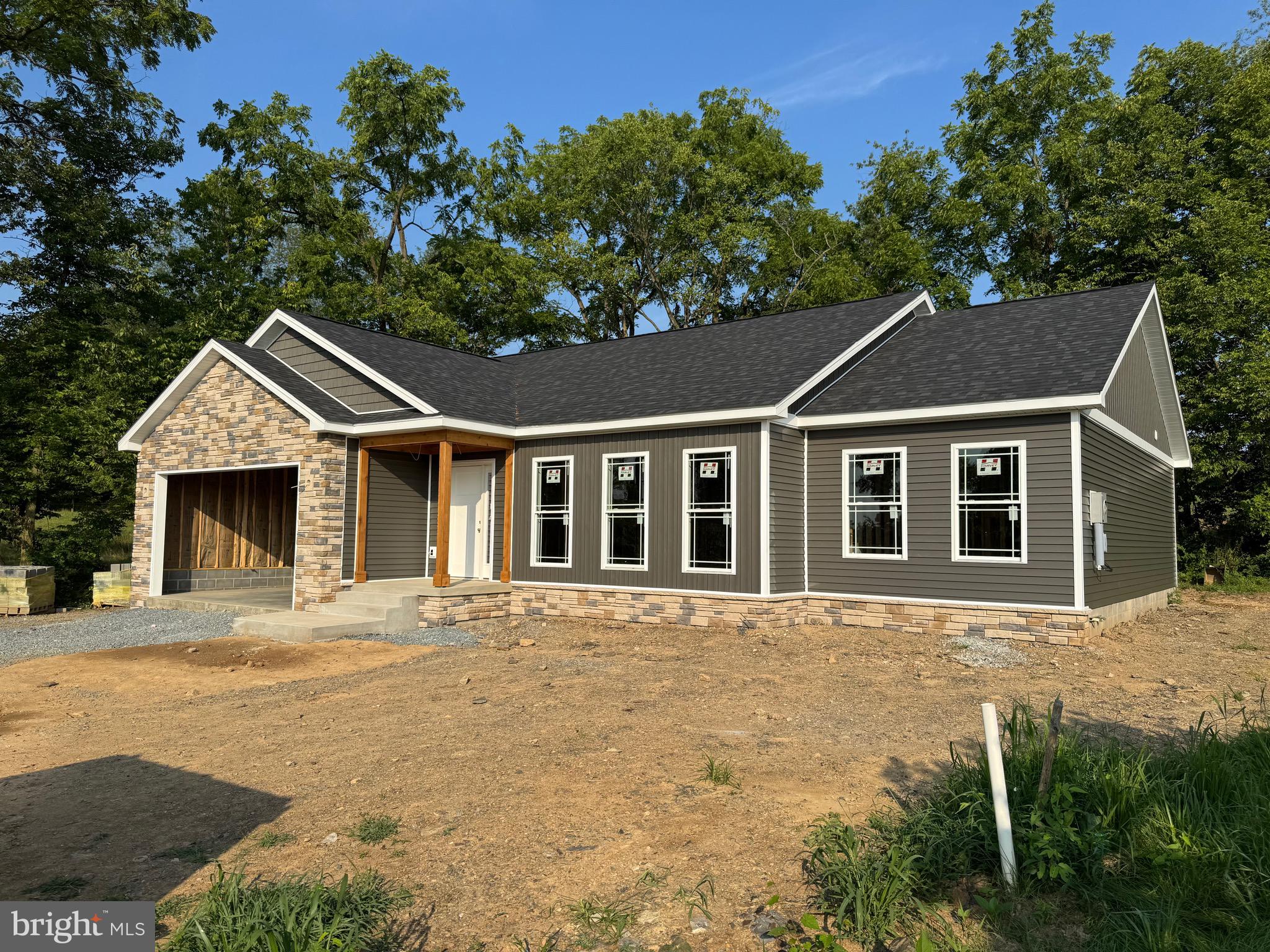 Brand new One Level living with great curb appeal, partial stone front and cedar shakes siding, this beautiful home features three bedrooms, two full baths, rear patio and a two car oversized garage. On a cul-de-sac and back to Farm Fields. Greencastle schools.
Available by end of September.
Elevated ceilings in main room featuring kitchen island with waterfall granite, kitchen includes stove, refrigerator, microwave, dishwasher, garbage disposal. Separate laundry room. Call for details and a tour.