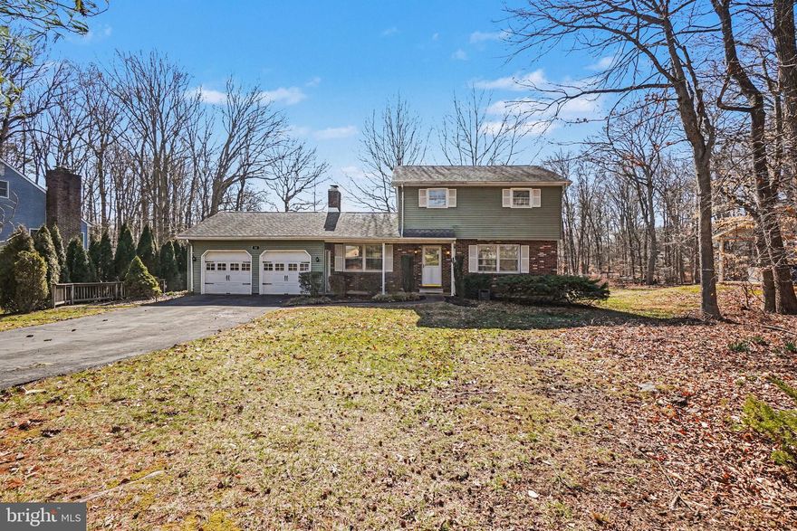 Recently Completed Fresh Updates!   New carpeting upstairs installed in all bedrooms.  Entire home freshly painted.  Move-in ready.  Tucked away on a secluded one-half acre lot just a short distance from the quaint town of North East, MD -you'll fall in love with 11 Colonial Circle.  This nicely maintained and highly energy efficient home offers three heating and cooling zones.  With triple glazed windows, 12 inches of ceiling insulation, hot water baseboard heat, and a mini-split system allowing for maximum comfort with lower energy costs.  A wood burning fireplace in the family room is an added bonus.  Leaf Filter gutter guards installed with a lifetime transferrable warranty.  You'll enjoy nature in the shaded back yard while using the three-season sun porch or the newly installed Trex deck.  Plenty of room outside for gardening, grilling, and play.   First floor laundry room with an additional half bath conveniently located near access to the rear yard.  The main level features a bedroom with attached full bathroom equipped with accessible shower stall.   Eat in kitchen with Corian countertops, bright and sunny formal dining and living room rounds out the main level.  Upstairs you'll find three additional generous size bedrooms, two with cedar lined closets, and a newly renovated full bath.   The lower-level basement has plenty of room for games, crafts, and includes a workshop area.  All shelving and cabinets are included for additional storage.  Walkout Bilko door accesses the rear yard.   Convenient to marinas along the Northeast River, Elk Neck State Park, restaurant, schools, and major roadways.  Schedule your tour of 11 Colonial Circle today.  You'll love what this home has to offer!