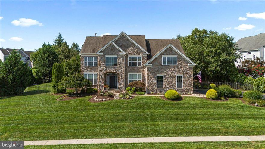An exceptional and extremely rare opportunity awaits with this exquisite 4600 square foot +/-  BETTER THAN NEW CONSTRUCTION ELEGANT STONE HOME in TURN-KEY MOVE-IN CONDITION! No expense was spared and this house WOWS as pride of ownership is evident in every inch of its PRISTINE CONDITION.   Built by, loved and owned since 2005 by ONE FAMILY who has carefully and meticulously MAINTAINED, EXTENSIVELY UPGRADED & RECENTLY RENOVATED - it is a TRUE UNICORN in this market and does not exist anywhere else in the AWARD WINNING TOP RATED CENTRAL BUCKS SCHOOL DISTRICT.  Prominently set and perched up high on a corner lot with Commanding Views of Nature & the Bucks County landscape in one of the most desired neighborhoods, this home basks in a SOUTHERN EXPOSURE and is drenched in NATURAL SUNLIGHT! Amazing curb appeal with an impressive Stone and Siding Facade (no stucco), Professional landscaping w/specimen plantings, ESTATE FENCING & a ONCE IN A LIFETIME POOL w/ WATERFALL, KITCHEN, OUTDOOR TV, FIREPLACE.  THIS RESORT LIKE SETTING IS PRIVATE AND MAGICAL yet you remain CLOSE TO EVERYTHING - just 5 minutes to Downtown Doylestown (train to Philadelphia, shopping & restaurants). This stunning 4 bedroom 2 full and 2 half bath showplace impresses w/ three levels of FRESHLY PAINTED designer interiors & substantial upgrades that rival and EXCEED most new construction available on the market today. Inside, this home feels brand-new with a wealth of designer-sourced finishes. Ceilings are dotted w/ beautiful fixtures and recessed lighting soars above the gleaming NEW Hardwood Floors, handsome millwork and NEW oversized windows trimmed w/ custom blinds. The gracious foyer is flanked by a grand staircase and spacious formal living and dining room that make a dramatic first impression. The house has GREAT CIRCULAR FLOW FOR ENTERTAINING and the Heart of the Home is the AMAZING Gourmet Kitchen offering abundant Custom Cherry Wood Cabinetry, Granite Counters and Stone Backsplash surrounding NEW professional Stainless Steel appliances, including a Gas range, French door Refrigerator, dishwasher and built-in microwave. An island/dining counter, desk, pantry and breakfast nook complete this world-class EAT IN KITCHEN w/ Breakfast Room that OPENS to the 2 STORY FAMILY ROOM - w/ STRIKING CUSTOM FIREPLACE and WALL OF WINDOWS framing verdant views. A half-bathroom, sunny home office, laundry room and mudroom storage w/ access to OVERSIZED 2 Car Garage add exceptional convenience to the main floor. This home is perfect for Intimate Family Gatherings or Grand Scale Entertaining both indoor and outdoor.  The new sliding door from the kitchen to your own private backyard retreat awaits! Take a dip in the saltwater pool surrounded by waterfalls, beautiful paver patio, and towering trees. Plan your next summer barbecue or game day gathering in the spectacular dining pavilion finished with a built-in grill, refrigerator and ample seating.  An outdoor fireplace and ceiling fan provide year-round comfort in this resort-like sanctuary. The HUGE Primary Suite offers a LARGE Walk-in Closet, Separate Sitting Room & SPA BATHROOM w/ DEEP SOAKING TUB, Stall Shower, separate vanities & private water closet. Three spacious and bright secondary bedrooms share a large hall bathroom w/ tub/shower & double vanity. The NEWLY FINISHED  WALKOUT LOWER LEVEL is an entertainer's paradise - HOST POKER GAMES & enjoy refreshments at the FULLY OUTFITTED WALK-UP WET BAR - challenge friends to a game of pool, or gather in one of TWO MEDIA ROOMS for epic movie nights. The lower level also includes a dance/fitness studio, storage and half bathroom. Additional features of this amazing home include: an oversized two-car garage,  state of the art alarm system with cameras, Smart Home, Irrigation system, All NEW Kitchen appliances, NEW Washer & Dryer, NEW designer carpet in the owner's suite and office, NEW Hardwood floors throughout, and Freshly Painted interiors.  DO NOT MISS THIS OPPORTUNITY!