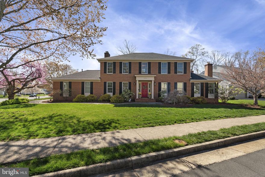 OFFERS DUE TO LISTING AGENT BY 3PM MONDAY 4/7 Nestled in the highly sought-after Little Rocky Run community of Clifton, Virginia, this stately brick-front colonial commands attention on a beautifully landscaped corner lot. Impeccably maintained and thoughtfully updated, this home offers a seamless blend of classic elegance and modern sophistication, making it a truly exceptional property.

The main level boasts exquisite engineered hardwood flooring, accentuated by crown and chair rail molding that adds a timeless touch. A distinguished private library with custom built-ins, French doors, and a fireplace provides a refined space for work or relaxation. Enjoy hosting special occasions in the elegant formal living and dining rooms, perfect for holidays and gatherings with family and friends. The inviting family room, also featuring a fireplace, flows effortlessly into the gourmet kitchen, where top-of-the-line stainless steel appliances, gas cooking, a spacious center island, custom cabinetry, and a pantry cabinet create the perfect culinary setting. A well-appointed laundry room on the main level adds to the home’s convenience.

Designed for year-round enjoyment, the magnificent screened porch—renovated in 2023—features skylights that bathe the space in natural light, offering a serene retreat and an incredible space to take in some fresh air.

The upper level is home to the luxurious primary suite, where a spacious bedroom, a custom-designed walk-in closet, and a spa-like en-suite bath create an atmosphere of indulgence. The primary bath is beautifully appointed with a frameless walk-in shower and an oversized jetted soaking tub. Three generously sized secondary bedrooms provide ample accommodations for family or guests.

The fully renovated lower level is designed for versatility and entertainment, featuring a sprawling recreation room with premium LVP flooring. A huge, spa-inspired full bath includes a second jetted soaking tub and a walk-in shower, while an expansive unfinished storage area offers endless possibilities. The basement has been pre-fitted with plumbing for a future wet bar, and a walk-out staircase provides direct access to the backyard.

This home has been meticulously upgraded with top-tier enhancements, including a brand-new roof and skylights (2024), a fully renovated basement with a new sump pump (2024), a screened porch conversion (2023), a first-floor and kitchen renovation with a gas fireplace (2015), new windows (2012), second-floor carpeting (2013), and a complete primary and second-floor bathroom renovation (2009). Additional updates include new landscaping and a walkway (2008) and a conversion to gas heating and cooking (1996).

With every detail carefully curated and every space impeccably maintained, this move-in-ready masterpiece offers a rare opportunity to own a home of unparalleled quality and craftsmanship in one of Clifton’s most desirable neighborhoods. Schedule your private showing today.