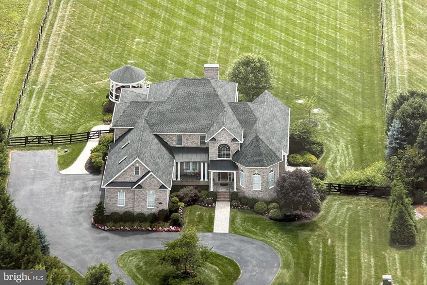 Welcome to 116 Cora Ln, Stephens City, VA – the perfect blend of architectural grace and sophistication. Nestled on a 2.44-acre estate, this home masterfully combines indoor luxury with the breathtaking beauty of outdoor living.
Step into a world where comfort meets elegance. This stunning Colonial-style home offers over 3,500 square feet of refined living space, featuring five luxurious bedrooms, four exquisite full bathrooms and two convenient half baths.
As you arrive, a beautifully paved circular driveway and lush landscaping welcome you. Drive towards the left side of the home to the entrance of a three-car garage, with a landing ample enough for a basketball hoop.
Inside, a grand foyer with double-height tray ceilings and luxurious wood flooring sets the tone for the elegance throughout.
The heart of this home is the gourmet kitchen, a culinary dream featuring restaurant-caliber gas cooking, double ovens, a top-of-the-line refrigerator, Bosch dishwasher, garbage disposal and ample counter space. This space seamlessly extends to an outdoor Trex deck, gazebo, and a custom-designed three-season enclosed porch, creating the perfect setting for outdoor entertaining. The beautiful fenced in backyard offers space to build a pool or to just enjoy the stunning Massanutten Mountain views in the background.
The great room, family room, and lower level each feature their own fireplaces, creating a cozy and inviting atmosphere for fall and winter evenings.
The main level boasts a grand primary suite with tray ceilings, custom designed closets, and an opulent primary bath, creating a private retreat of unmatched comfort.
On the second level, two sumptuous bedrooms share a “Jack & Jill” bathroom and a third bedroom boasts an ensuite bath. An additional large space is perfect as a playroom or an extra office, offering flexibility to suit your needs.
The sellers meticulously designed the 2,500 sqft walkout lower level, transforming it into an entertainment paradise. This expansive space features a spacious family room, a full bar with a wine refrigerator, dishwasher, garbage disposal and sink, and a wine cellar. They also included a full-size bedroom and bathroom, perfect for an in-law or guest suite, as well as a quiet and secure office with custom cabinetry, a gym, and multiple storage areas.
At 116 Cora Ln, every view is a vista, every room a statement of luxury and harmony with nature. This isn't just a home; it's a lifestyle of unmatched elegance and luxury.