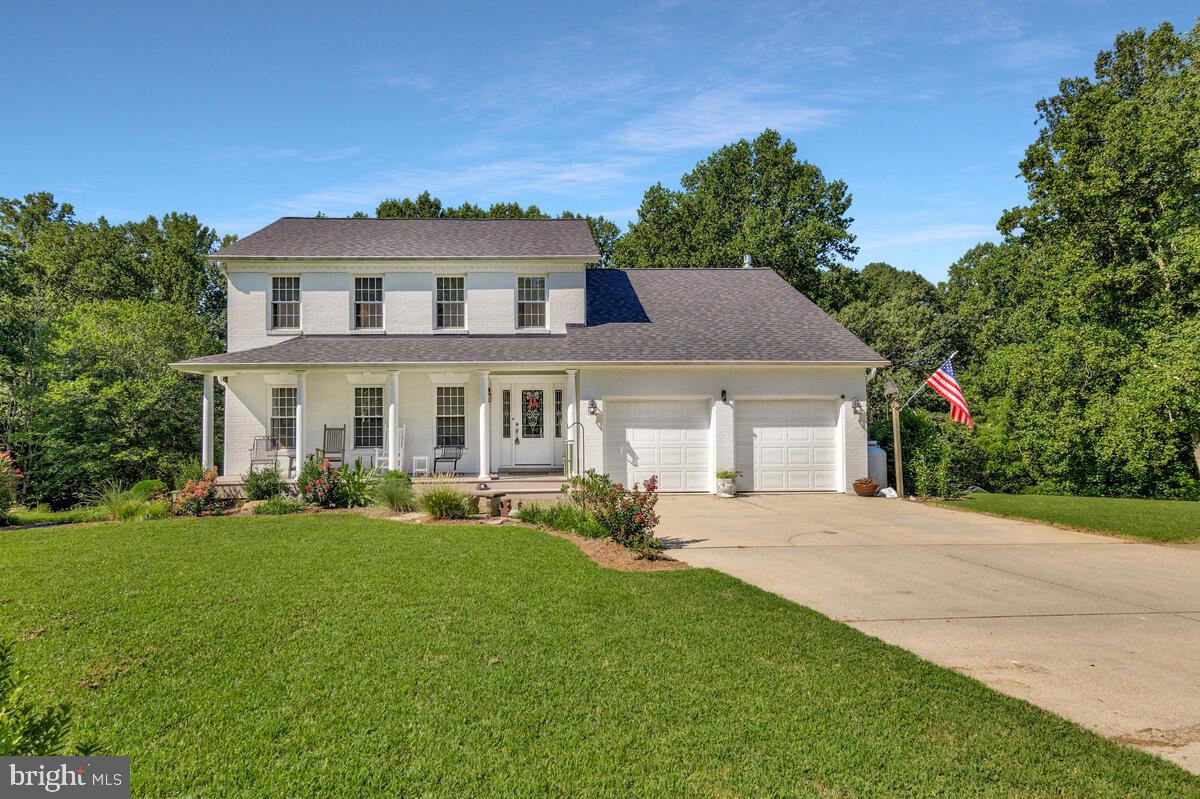Farmhouse Charm Meets Modern Living in Northern Calvert! Over 52K in upgrades and updates have been made to this home since 2022! This beautifully updated farmhouse-style colonial blends timeless charm with thoughtful modern upgrades—inside and out. Nestled on over 2 peaceful acres just minutes from the Patuxent River, this property offers a serene retreat with easy access to D.C., Annapolis, the Chesapeake Bay, and nearby shopping and dining. Step onto the welcoming, low-maintenance front porch and into a light-filled, turn-key interior. The main level features gleaming hardwood floors and a stunning eat-in kitchen with brand-new, expansive cabinetry, quartz countertops, a large center island, stainless steel appliances, and a stylish backsplash. Just off the kitchen, a cozy step-down family room with a gas fireplace leads to a spacious porch addition and a screened-in maintenance-free sunroom—perfect for relaxing or entertaining while overlooking the private backyard oasis. Also on the main level: a remodeled powder room and a formal dining room ideal for gatherings. Upstairs, hardwood floors continue throughout. The spacious owner’s suite includes a walk-in closet and a beautifully renovated en-suite bath with designer tile, upgraded fixtures, and a sleek stand-up shower. Two additional bedrooms offer generous space, and the hall bath has been fully renovated with fresh finishes from top to bottom. Below the sunroom and porch, a full-length patio expands your outdoor living space. The exterior also boasts a large driveway with ample guest parking, extensive landscaping, an oversized shed/workshop, a new architectural shingle roof, newer windows, and updated HVAC. This home is the perfect blend of country comfort and modern convenience—ready to welcome you home!
