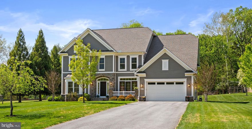 Welcome to 413 Vierling Drive, a stunning masterpiece in the sought-after Drumeldra Hills neighborhood of Silver Spring. Thoughtfully crafted in 2017, this home exudes timeless elegance while offering every modern convenience. Set on over an acre of impeccably landscaped grounds, this property is as serene as it is impressive.

Boasting 7 bedrooms and 5.5 baths, the residence spans an expansive 7,500 square feet of beautifully designed living space. The heart of the home is a modern chef’s kitchen, outfitted with stainless steel appliances, granite countertops, ample cabinetry, and not one but two dishwashers—perfect for hosting gatherings of any size. A cozy wood-burning fireplace anchors the living area, while the main level offers a versatile primary bedroom or guest suite to suit your needs.

Upstairs, the graciously sized primary suite is a true retreat, featuring dual walk-in closets and a spa-like bath designed for ultimate relaxation. A large linen walk-in closet and upper-level laundry room add convenience to everyday living. Additional highlights include a central vacuum system, a two-car garage with extra storage, and thoughtful details around every corner.

Step outside to enjoy the peaceful setting, where mature landscaping enhances the property’s natural beauty. Whether you’re entertaining on the deck, relaxing, or simply taking in the tranquility of Drumeldra Hills, 413 Vierling Drive offers the perfect blend of luxury, comfort, and charm.
This is more than a home—it’s a lifestyle waiting to be embraced.