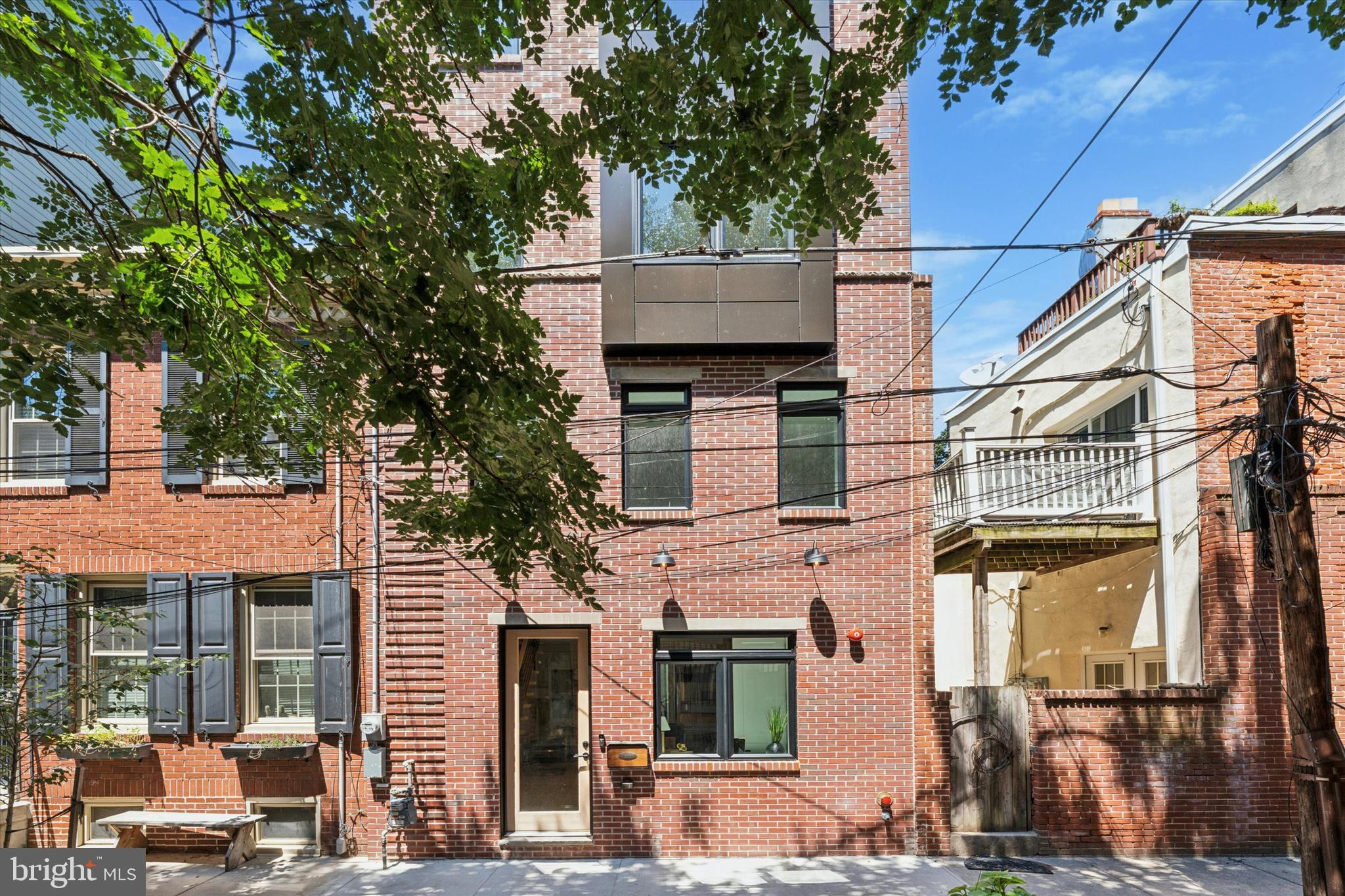 Welcome to 303 Pemberton Street, A Masterpiece of Modern Living in the Heart of Historic Queen Village
Set on a picturesque, tree-lined block within the coveted Meredith School District, this extraordinary extra-wide, four-story residence has been meticulously reimagined to offer the perfect blend of historic character and contemporary luxury.
Every detail has been thoughtfully curated, from the exposed original red brick and custom floating oak staircase to the sleek engineered floors and refined European finishes throughout. With four bedrooms, a dedicated office area, three and a half designer bathrooms, and multiple flexible living spaces, this home is designed for both elevated everyday living and seamless entertaining.
The chef’s kitchen is a true showpiece, featuring custom European cabinetry, high-end appliances, and sophisticated modern design. The open-concept layout connects the living and dining areas effortlessly, making it the ideal setting for gatherings of any size.
On the fourth floor, a custom wet bar leads to a spacious rooftop deck with breathtaking panoramic views of the Center City skyline, perfect for relaxing evenings or weekend entertaining. The primary suite offers a spa-like retreat with designer porcelain tile, a soaking tub, double vanity, and a spacious walk-in shower. Dual-zone heating and cooling ensure year-round comfort, while a full-size washer and dryer offer added convenience.
The extra-wide layout allows for generous room sizes and exceptional flow across all levels. Located in the heart of Queen Village, just steps from beloved restaurants, boutique shops, parks, and public transportation, this home offers the rare opportunity to enjoy luxury living in one of Philadelphia’s most vibrant and desirable neighborhoods.
A real estate tax abatement is pending. Don’t miss your chance to own this stunning architectural gem. Schedule your private showing today.
