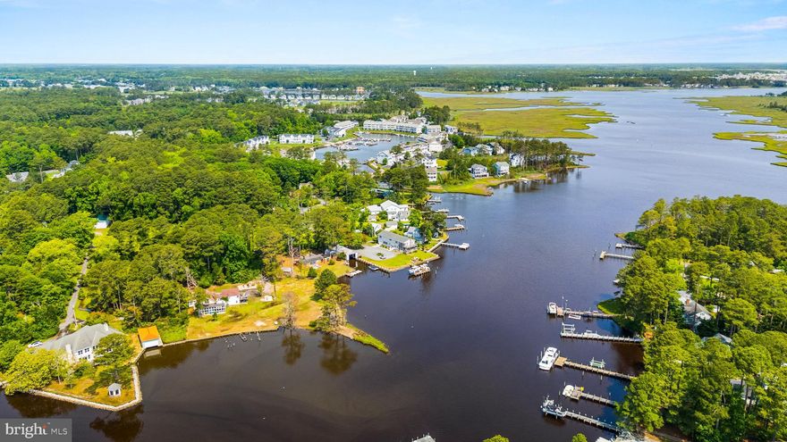 Discover a truly unique opportunity to own over 1 acre of prime waterfront land, with 400’ of shoreline on Herring Creek, in the highly sought-after area of West Ocean City. This expansive residential lot offers stunning panoramic water views and direct bay access — ideal for boating, fishing, kayaking, or simply relaxing by the water.  Design your custom estate on this over bucolic lot, complete with room for additional buildings, outdoor entertainment areas, private docks, and boat lifts (subject to local approvals). Located just minutes from Ocean City’s beaches, boardwalk, festivals, restaurants, shopping, and golf courses, this is coastal living at its finest.  Whether you’re planning a year-round residence or a luxury vacation retreat, this property offers the perfect blend of space, privacy, and location. Bring your vision and start building your dream on the water! Please DO NOT drive down private drive.   Owners have dogs.  Call listing agent to walk the property.