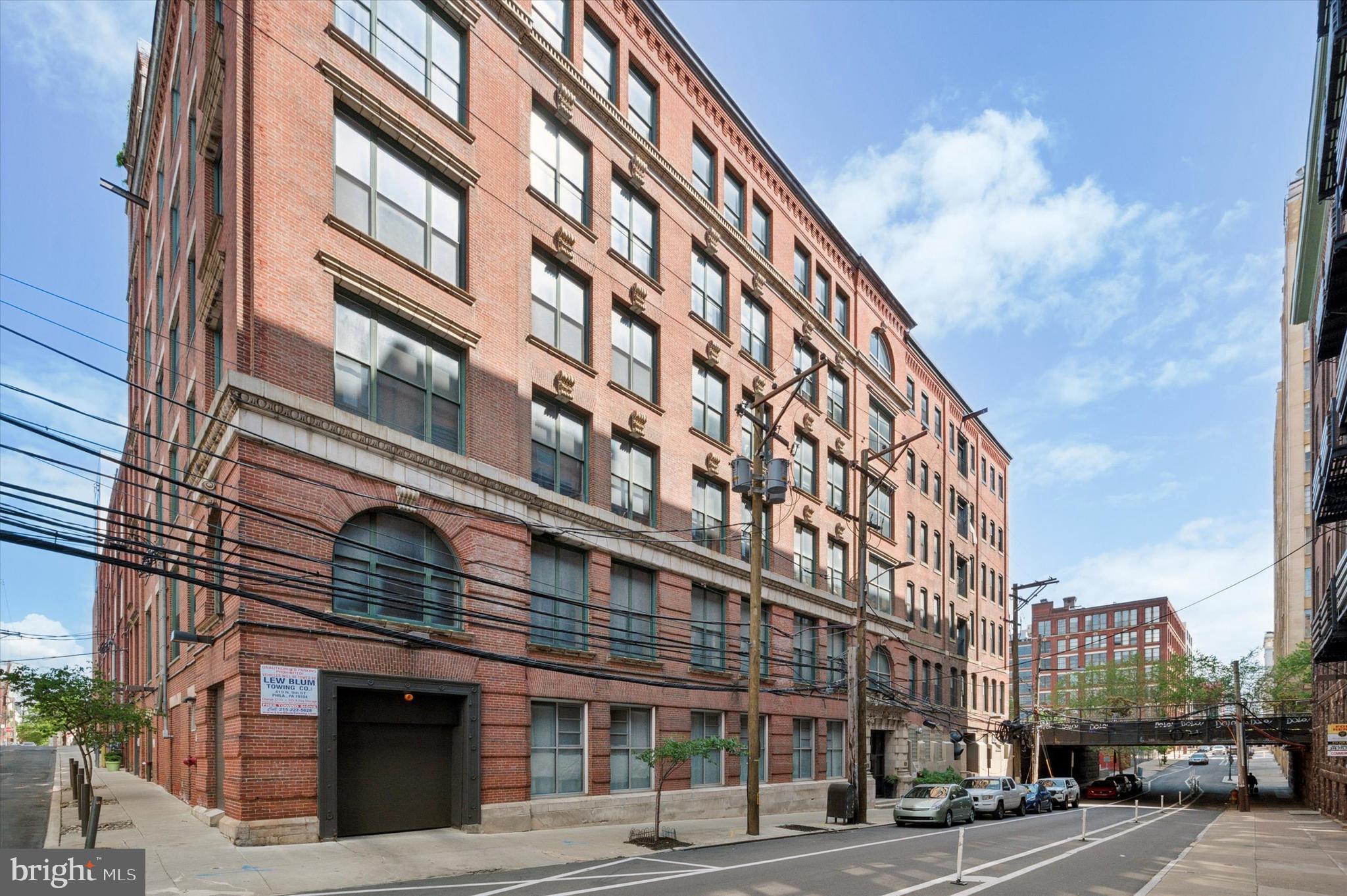 This stunning loft-style condo blends historic charm with urban sophistication. Located just south of Broad and Spring Garden, this residence places you at the heart of one of Philadelphia’s most vibrant and accessible neighborhoods. Set in a former garment factory, the building retains its authentic character with original hardwood floors, soaring ceilings, and exposed wooden beams that highlight its industrial past. Inside, the open-concept layout offers a spacious living area ideal for both relaxing and entertaining. The beautifully updated kitchen features stainless steel appliances, a dynamic backsplash, floating shelves & an island for extra work space or dining, perfect for hosting gatherings with family and friends. Oversized windows bring in natural light, creating a warm and inviting atmosphere throughout. The bedroom offers privacy and comfort, while the modern bathroom features a double vanity and abundant storage. Just blocks from Prohibition Taproom, Underground Arts, the Trestle Inn, Giant grocery store and the cultural energy of Chinatown, Fairmount, and Northern Liberties. Commuting is a breeze with the Broad Street Line just a short walk away and easy access to major highways for seamless travel in and out of the city.