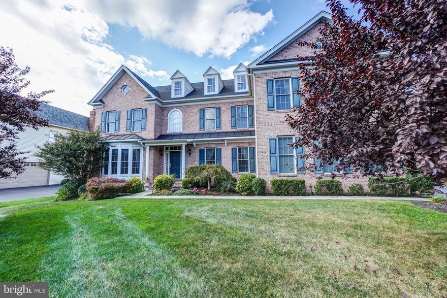 Four Level Spectacular Brick front East facing Estate Home with luxury features in  sought after Village of Waxpool in Ashburn on a beautiful 0.5 Acre wooded cul-de-sac lot. Oakton Alternate floor plan built by Craftmark Homes, this home was built as a builders spec home, it is loaded with incredible upgrades and design features throughout. Over 8000 sq ft finished home with Six large bedrooms,  six full bathrooms and one recently renovated half bathroom on main level (2019), upgraded ceramic tiles, expansive crown moldings &  metal railing package. Interior finishes include a open layout chef’s gourmet kitchen with granite kitchen tops & oversized island, six burner gas cooktop,  backsplash, top-of-the-line cabinetry with undermount lights and GE Monogram appliances along with custom pantry, family room with elegant stone fireplace &  5.1 home theater pre wire, formal living and dining rooms, a light filled morning room, private study with custom wood shelves built in, and mudroom with designer bench and shelves. Custom draperies on the main level. The stunning master suite features a cathedral ceiling, huge bedroom area, a separate sitting area, a big bathroom with jetted oversized whirlpool tub, 2 walk-in custom closets, and a double side glass fireplace. The upper level also has three additional large bedrooms with private bathrooms and a custom closet in one of the bedrooms.  Finished 4th level loft with a living area, bedroom and bathroom along with custom storage armoires. The basement is fully finished with a huge rec-room, open media room with professional 5.1 sound system, gym, full size wet-bar, stone fireplace and a large bedroom with a full bathroom. The outdoor space features a custom patio with LED lights and a screened porch on Trex deck. 10 zone Sprinkler system. Wood flooring on three levels & custom paint throughout the house. New Roof (2019), New High efficiency Carrier HVAC system on both levels (2019), New Water Heater (2018). Three Car Side entry garage with electric vehicle charger.  Structured Wiring Package & plenty of LED recess lights in every room. Andersen Double Hung windows throughout the house. Upgraded leadwalk & low voltage landscape lighting, Garage has professional epoxy flooring along with whole house Water softener/filtration system. House is prewired for a generator with Manual transfer switch.