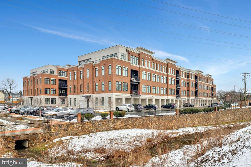 Rarely Available Penthouse Condo in Sought After King Street Station-Perfection in The Heart of Downtown Leesburg-One of Only a Few Condos in the Entire Community with an **Oversized Private** Rooftop Terrace and By Far the Best View in Leesburg-Ultra Modern and Virtually Brand New with Extensive Upgrades and Amenities Throughout-Gorgeous All Brick Building with Plush Lobby Entrance and Elevator-Only 4 Units Per Floor Provide Space and Privacy-10 Foot Ceilings with Floor to Ceiling Windows Engulf the Space with Endless Natural Light-The Kitchen Includes the Finest Finishes with Cotemporary White Cabinets, Oversized Island, Professional Stainless Appliances & Granite Counters-Most of the Home is Adorned with Exotic Wide Plank Hardwood Floors-The Family Room Center Piece is a Grand Fireplace with Custom Crafted Built In Cabinets-A Generous Secondary Bedroom Makes a Great Office and Guest Room-The Owner's Suite is Beyond Impressive with a Large Walk-In Closet and a Spa Like Owner's Bath-The Rooftop Terrace is Perfect for Enjoying Coffee in the Morning or Entertaining Friends with The Panoramic View -An Oversized Garage with High End Floor Coating -Additional Features Include Endless Recessed Lighting, High End Built-In Systems in Closets and Pantry, Huge Awning with Two Panel Extension, Garage Ceiling Storage Rack that Raises and Lowers Automatically and So Much More....This Property is Literally Across the Street from the Best Restaurants and Shops in Leesburg...Turn Key Perfection in The Ultimate Location in Loudoun County/Northern Virginia-Only 20 Minutes to Dulles Airport!
