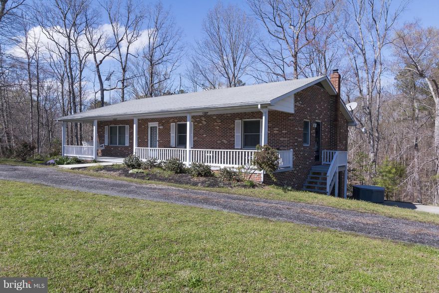 Wow! Custom built home in immaculate move in condition on over 2 acres. Reflect on open free flowing interior with new beautiful bamboo flooring throughout. Tastefully decorated plus remodeled bathrooms w/ granite counters and ceramic tiled baths. Expansive rec room w/ an efficient pellet stove for the cold evenings. Circular drive w/ ample parking to include 2 carport & 2 car garage. Call today!