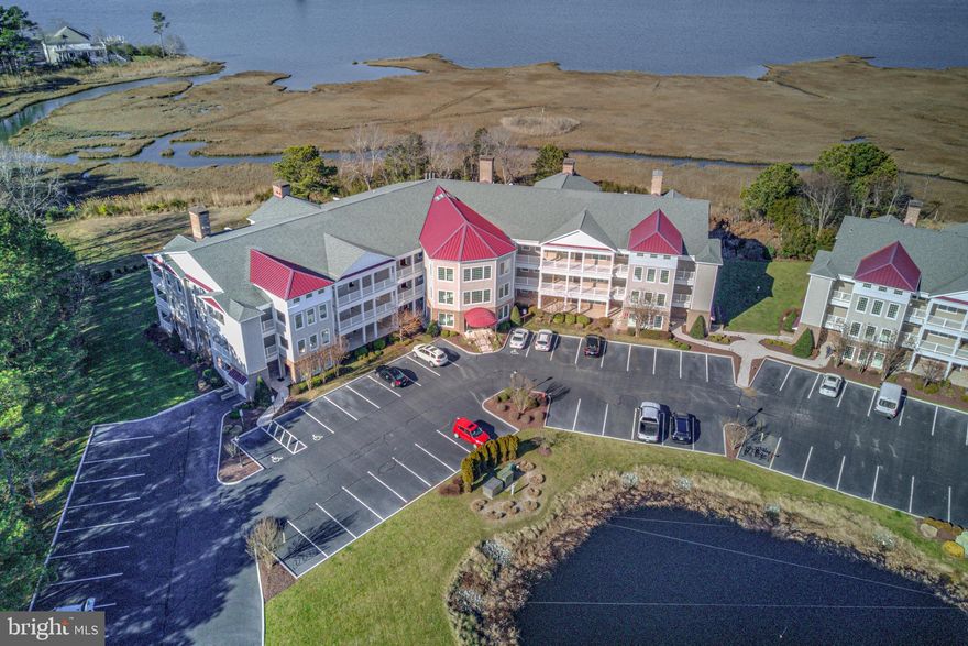 New Price! Beautiful luxury 3 bedroom 2 full bath first floor unit in Points Reach complex of Ocean Pines with a beautiful view. Gracious entry hall leads to gourmet cook's delight kitchen with bar seating, granite counter tops and pantry closet. Dining and living areas have views to balcony that stretch across the entire unit. Hardwood floors in living areas and carpet in bedrooms. Corner gas fireplace in living room. Primary suite has 2 walk-in closets and bath with whirlpool tub/shower. Built-in Viking Grill on balcony. Brand new Geo-thermal heat pump and Hot Water Heater and average about $200 a month electric bills. Included is a personal storage room in the Bike Barn. Kayak storage is also available for rent. A great tranquil view of the wetlands and open water. Ready for immediate occupancy. Owners have just touched up the paint in the hallway, laundry room, kitchen , dining and living rooms . They would consider a contingent offer and might negotiate some owner financing if needed for a short period of time.